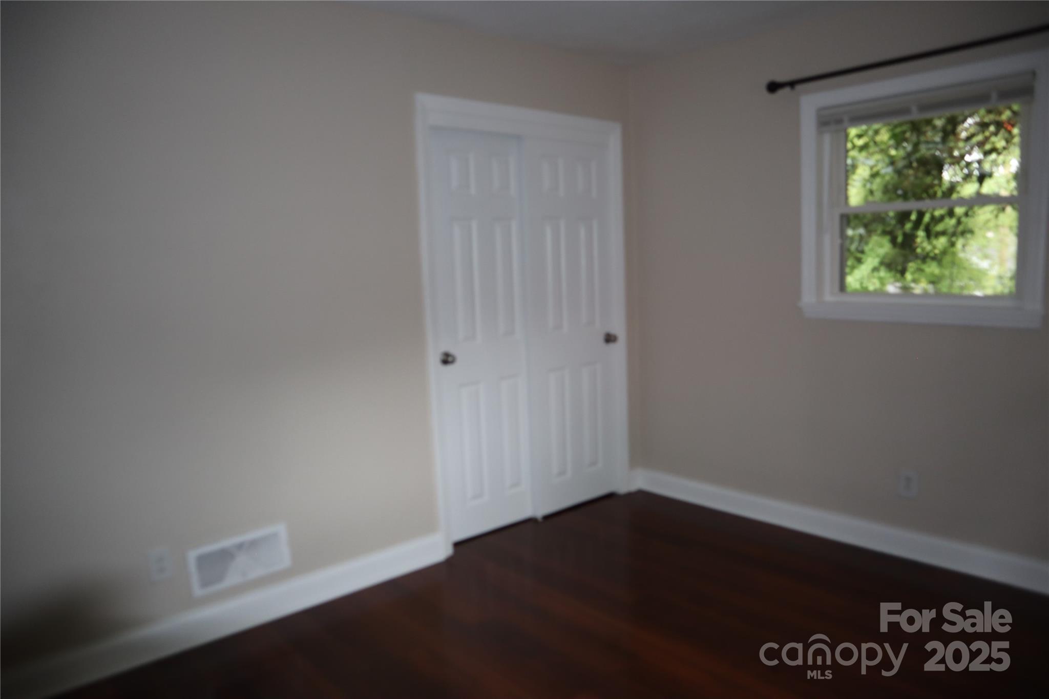 1703 Tyvola Road Charlotte, NC 28210 - Photo 12 of 17 an empty room with a window