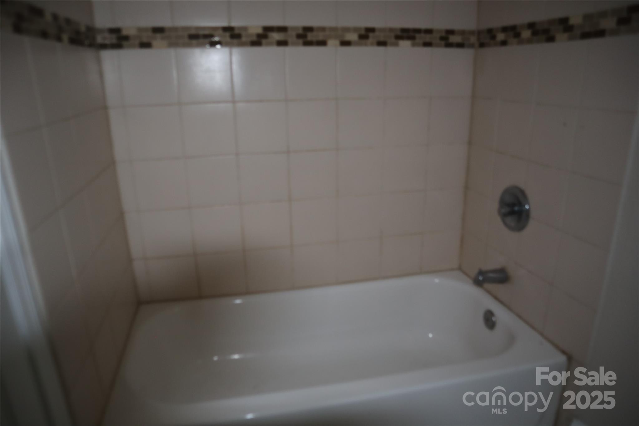 1703 Tyvola Road Charlotte, NC 28210 - Photo 13 of 17 a view of a bathtub in bathroom
