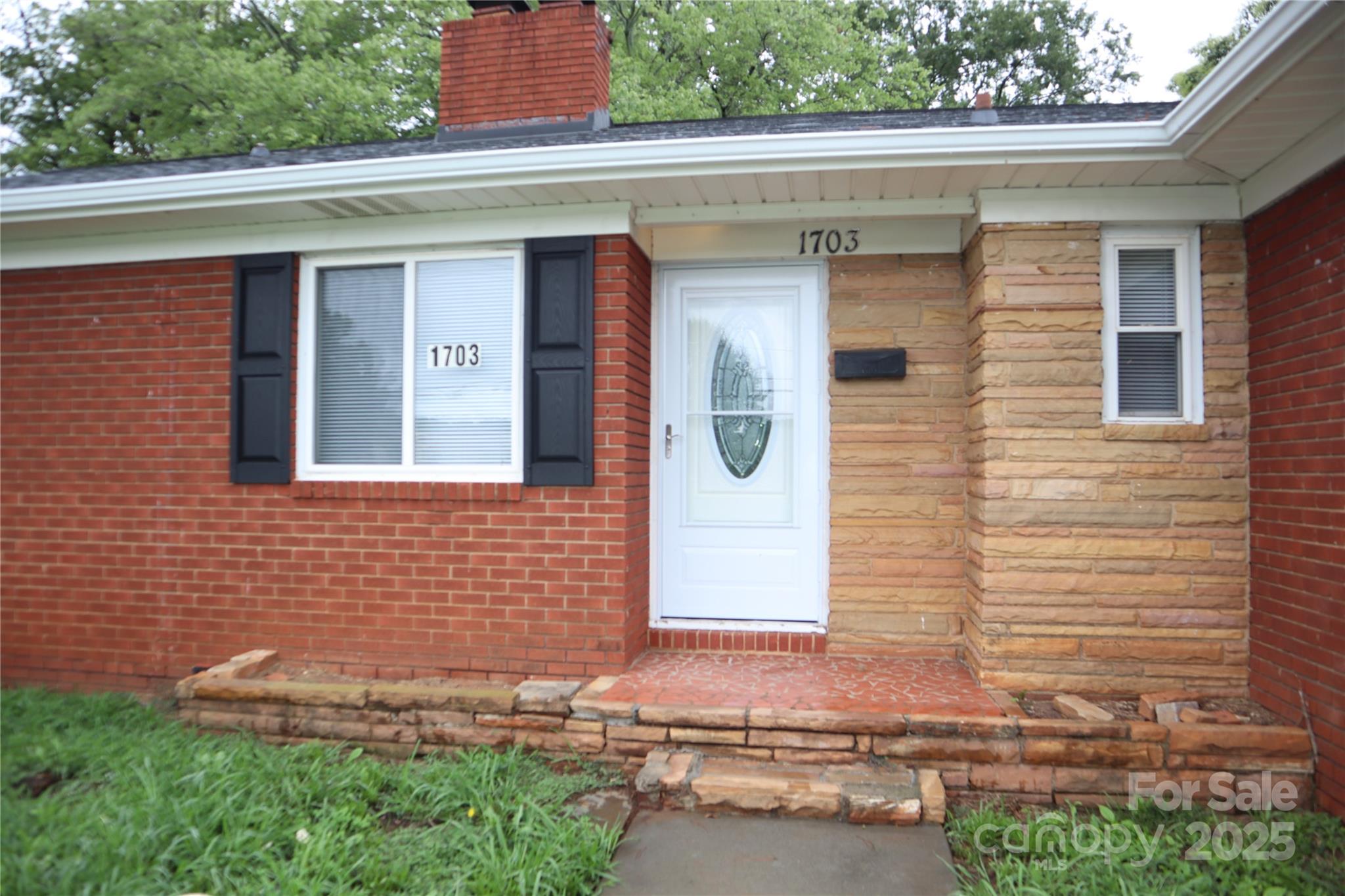 1703 Tyvola Road Charlotte, NC 28210 - Photo 16 of 17 a front view of a house with a yard