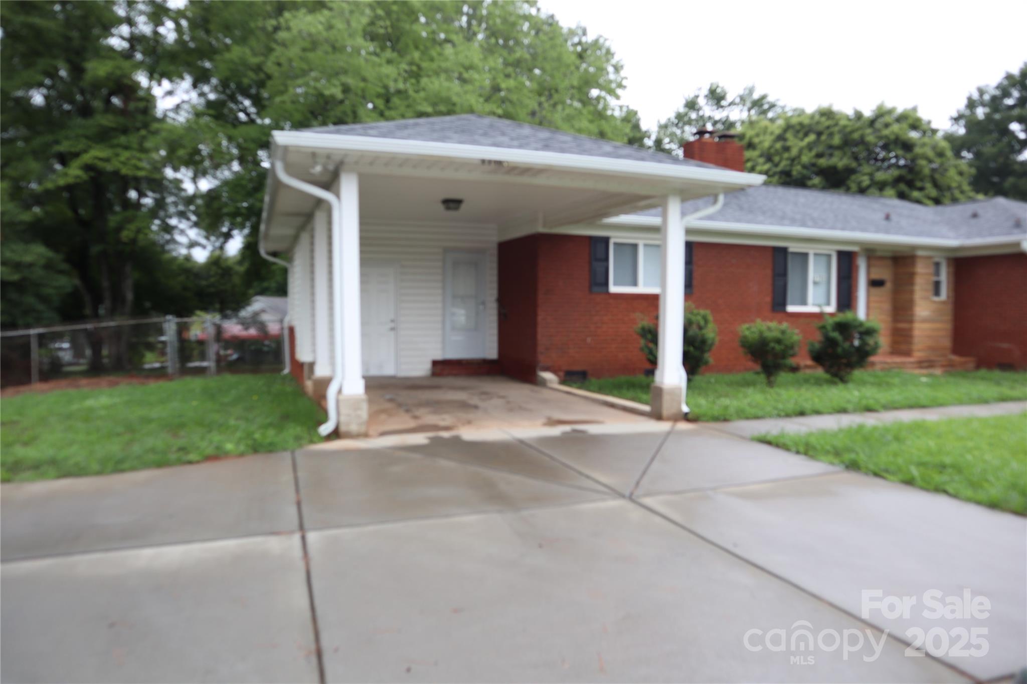 1703 Tyvola Road Charlotte, NC 28210 - Photo 17 of 17 a view of a house with a yard