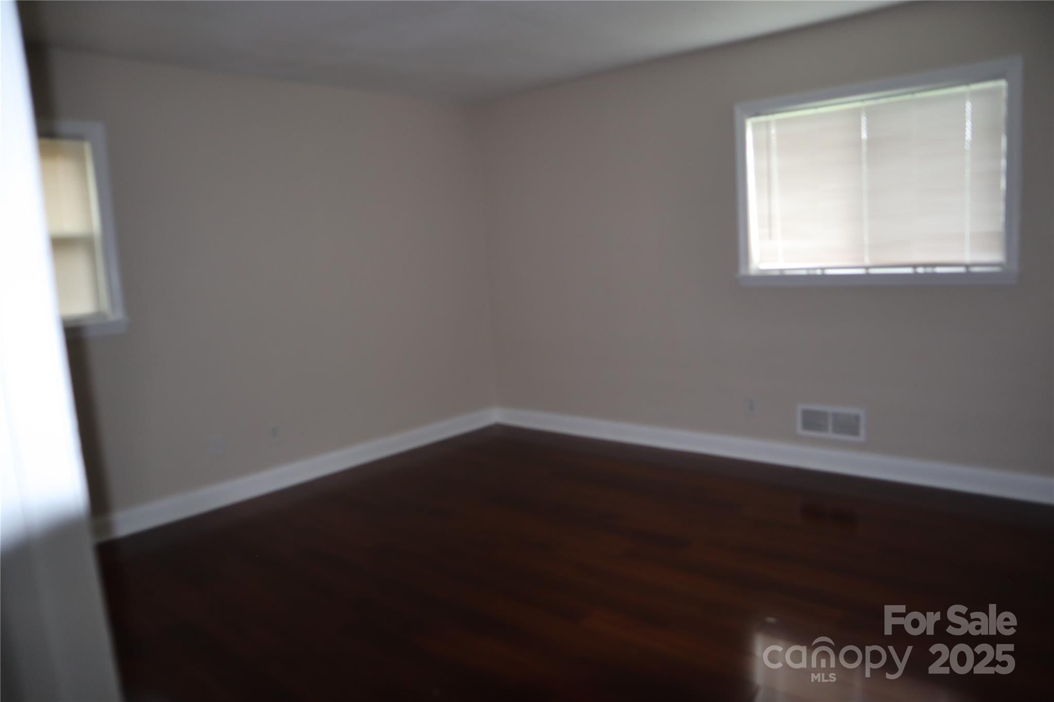 1703 Tyvola Road Charlotte, NC 28210 - Photo 8 of 17 a view of a small space with wooden floor and a window