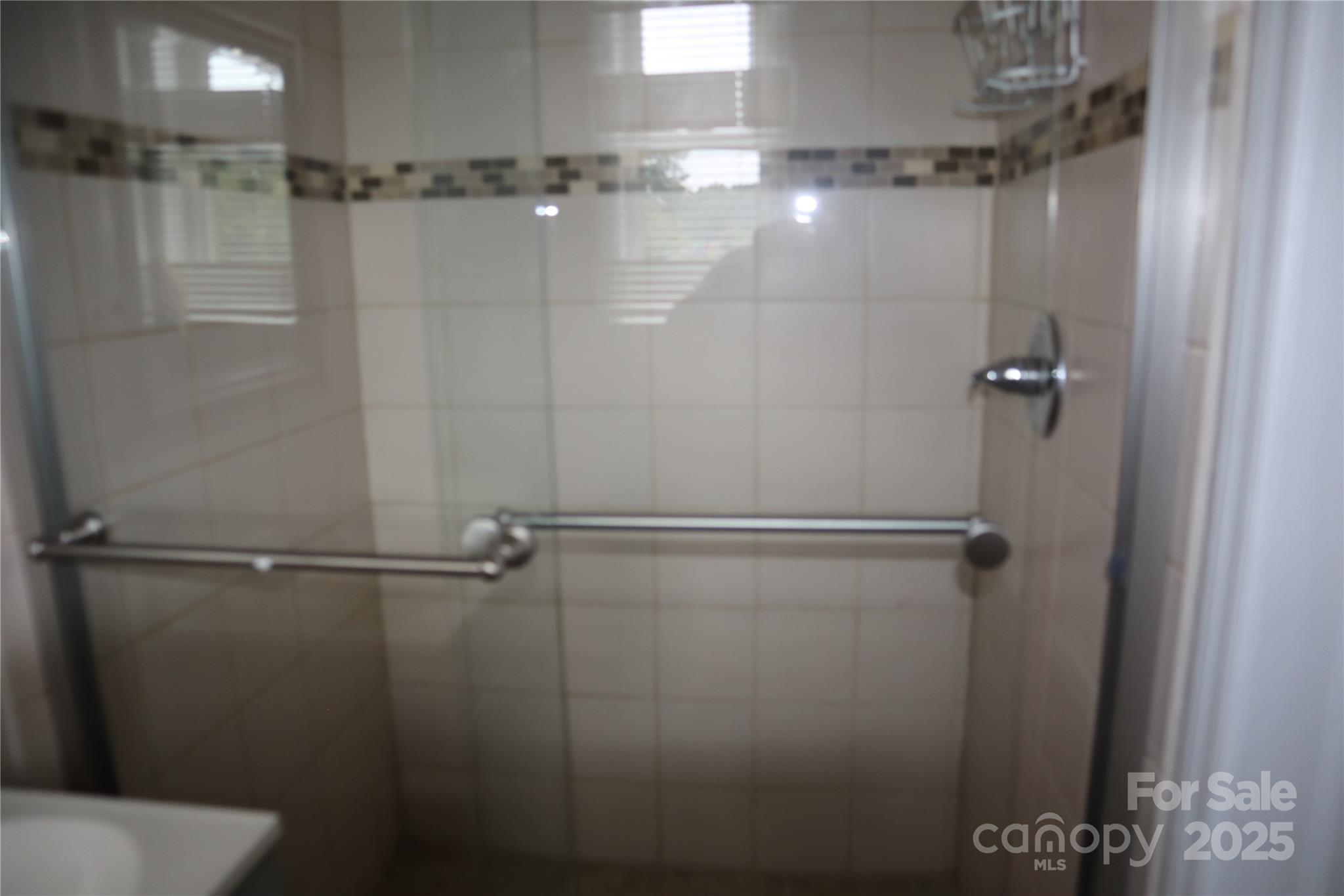 1703 Tyvola Road Charlotte, NC 28210 - Photo 10 of 17 a bathroom with a shower