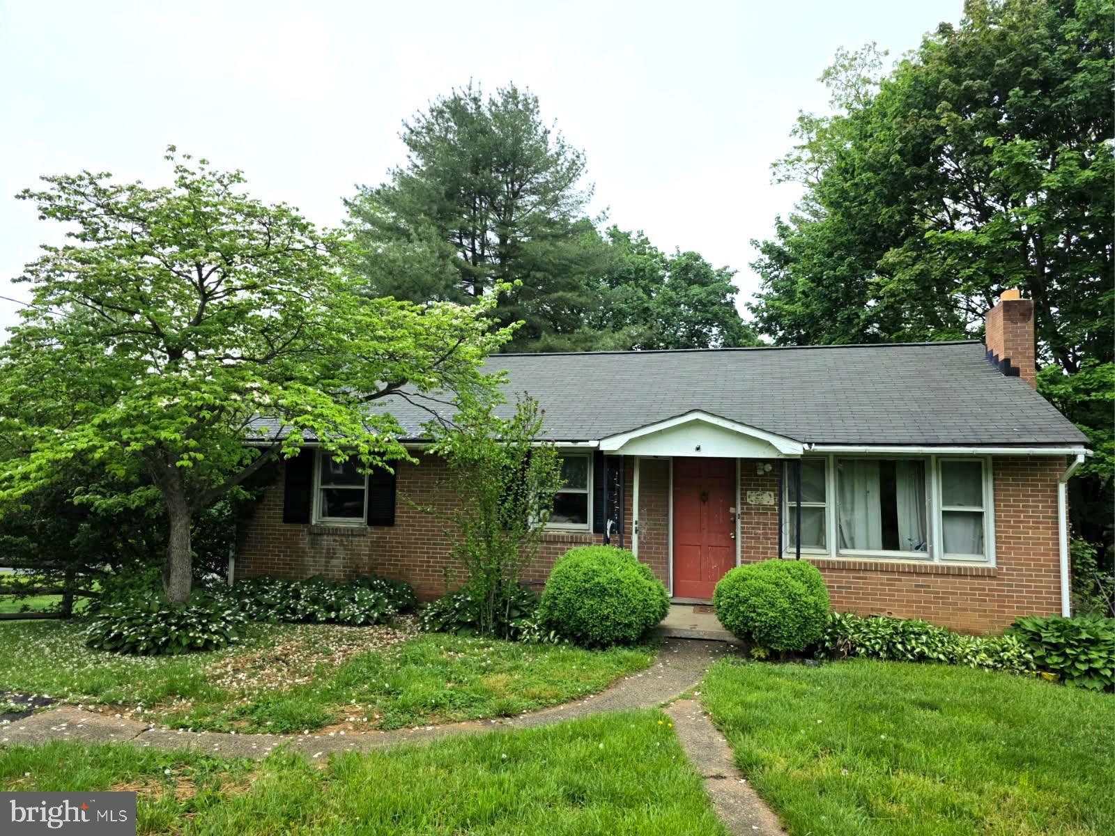217 Main Street Delta, PA 17314 - Photo 13 of 16 a front view of a house with a yard and trees