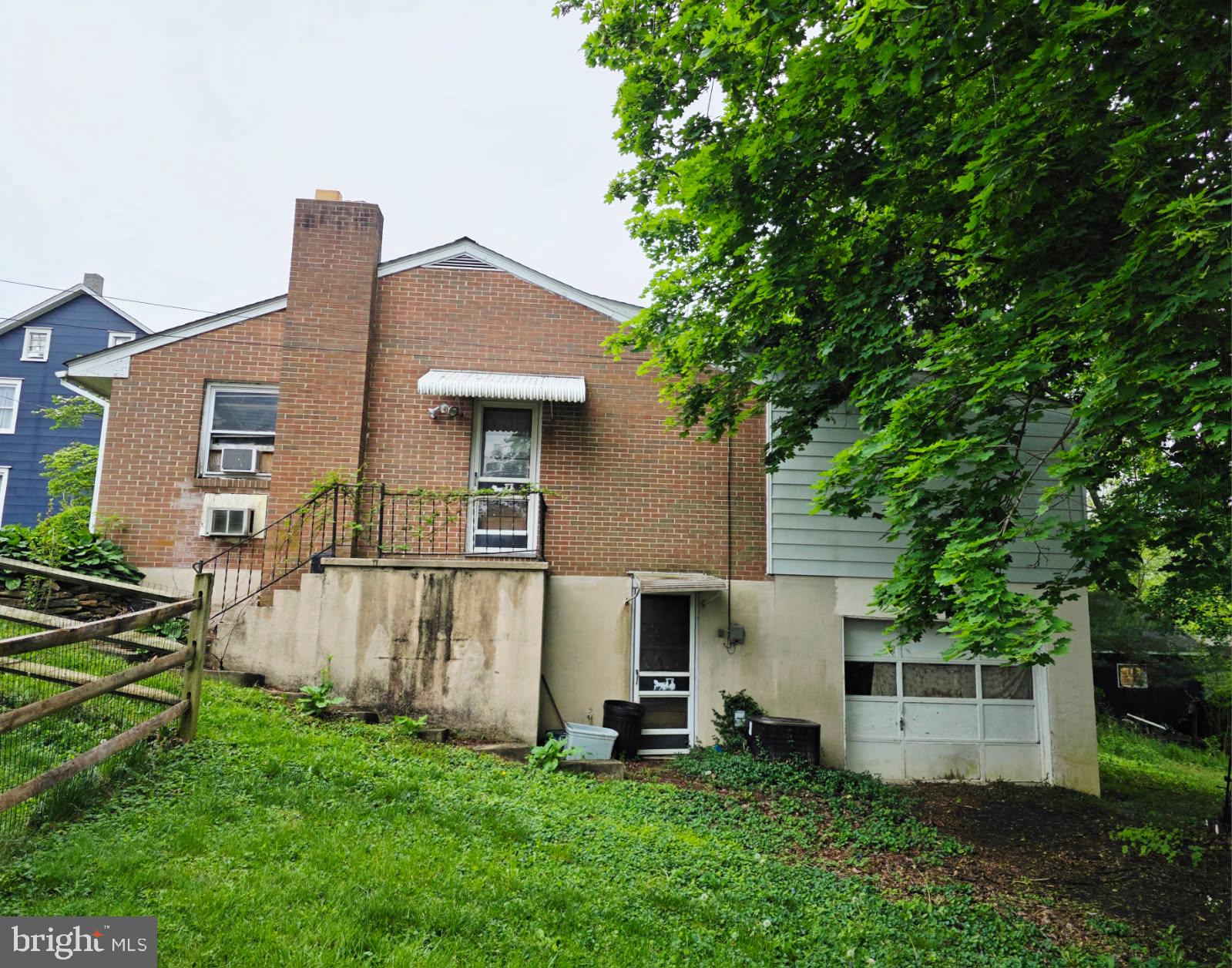 217 Main Street Delta, PA 17314 - Photo 16 of 16 a front view of a house with a garden and yard