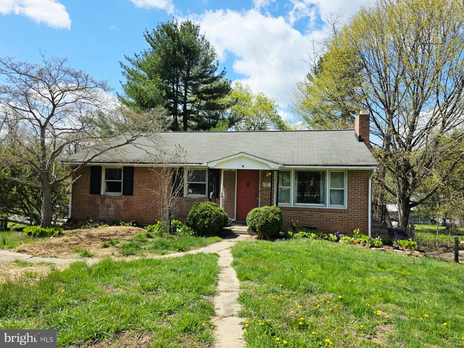 217 Main Street Delta, PA 17314 - Photo 3 of 16 a front view of a house with a garden
