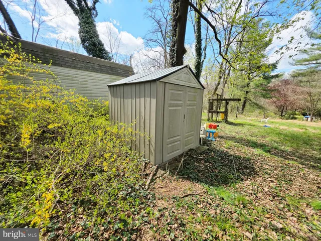 a view of a backyard of the house