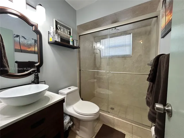 a kitchen with stainless steel appliances granite countertop a sink dishwasher stove a microwave oven with granite countertops and cabinets