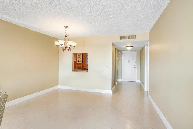 a view of a hallway with a chandelier