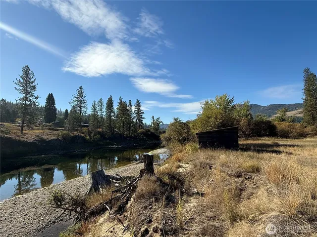 a view of a lake with a yard