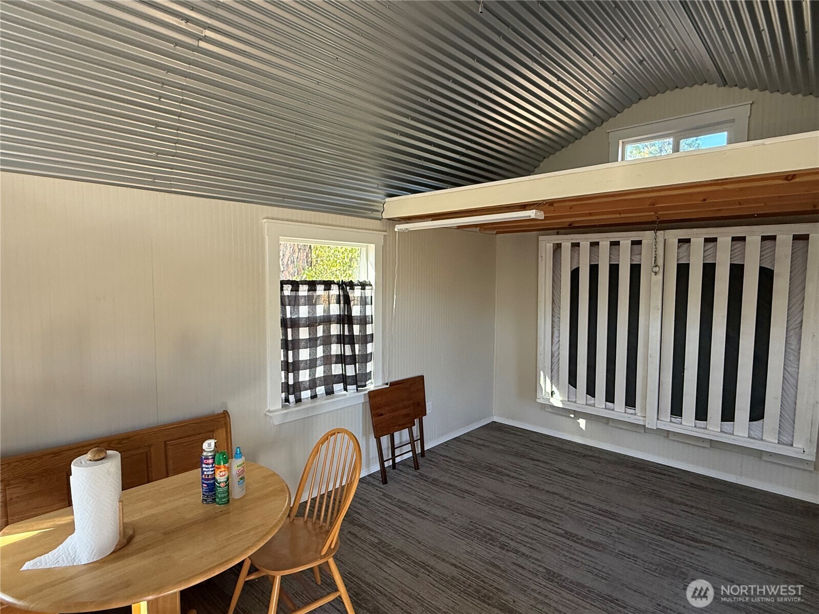 0 Tbd Highway Curlew, WA 99118 - Photo 11 of 19 a dining room with furniture and wooden floor