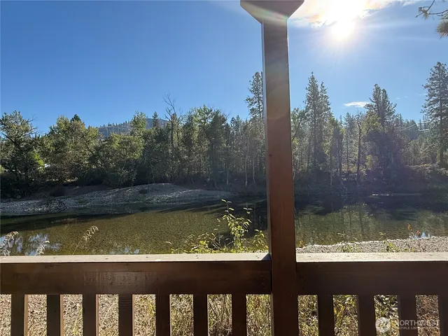 a lake view with boat and small boats