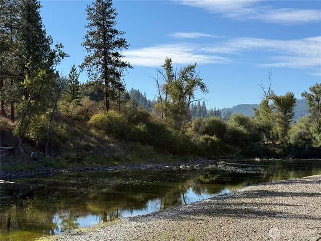 a view of a lake with a house in the background