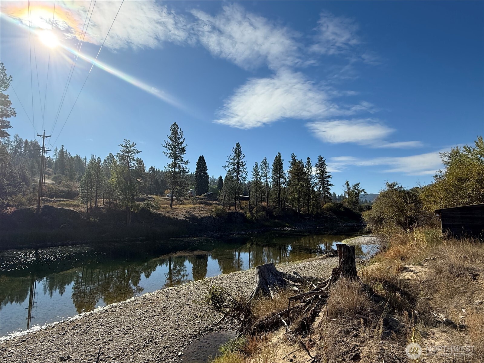 0 Tbd Highway Curlew, WA 99118 - Photo 4 of 19 a view of a lake with a house in the background