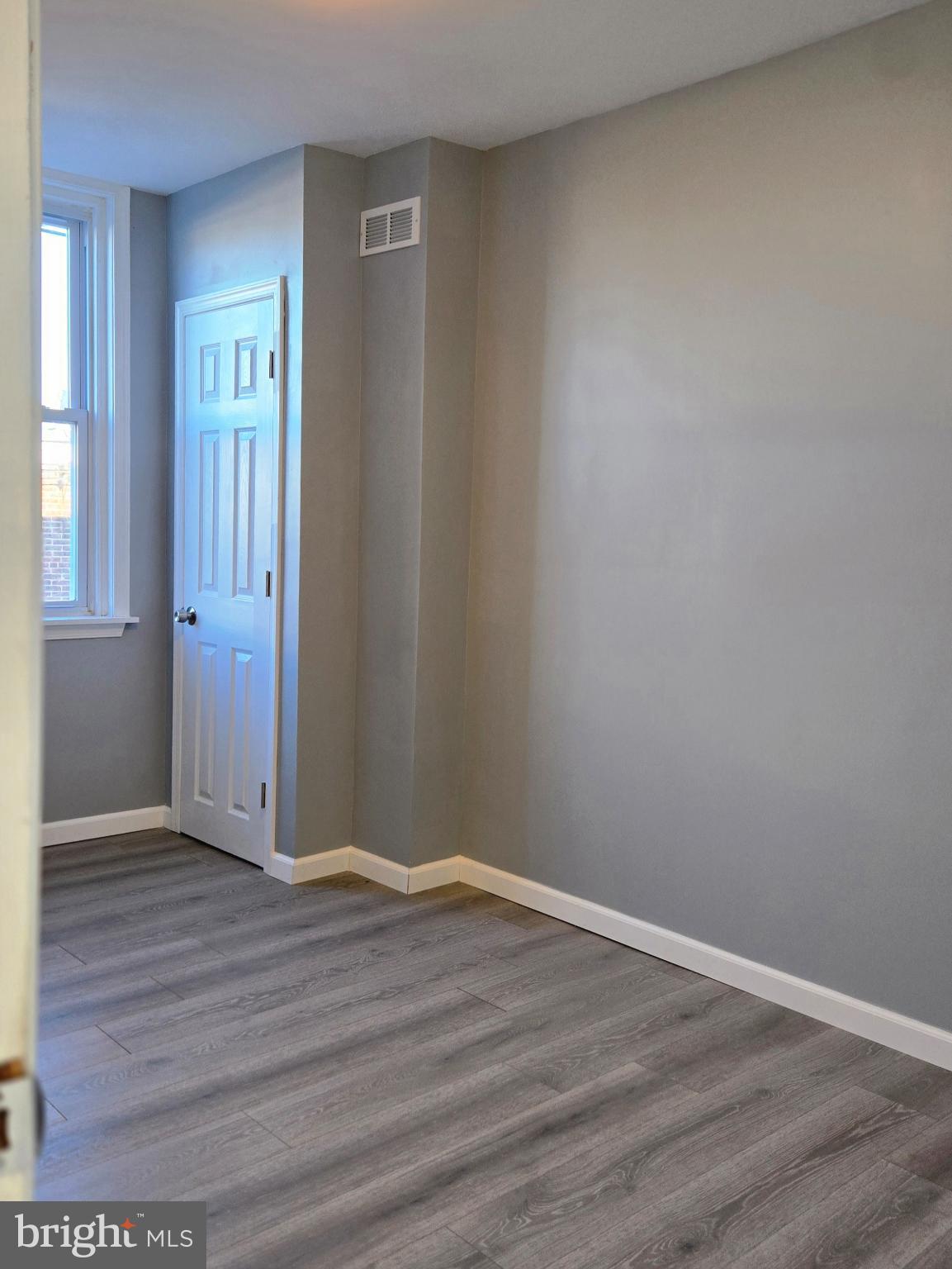 6733 Linmore Avenue Philadelphia, PA 19142 - Photo 28 of 55 wooden floor in an empty room