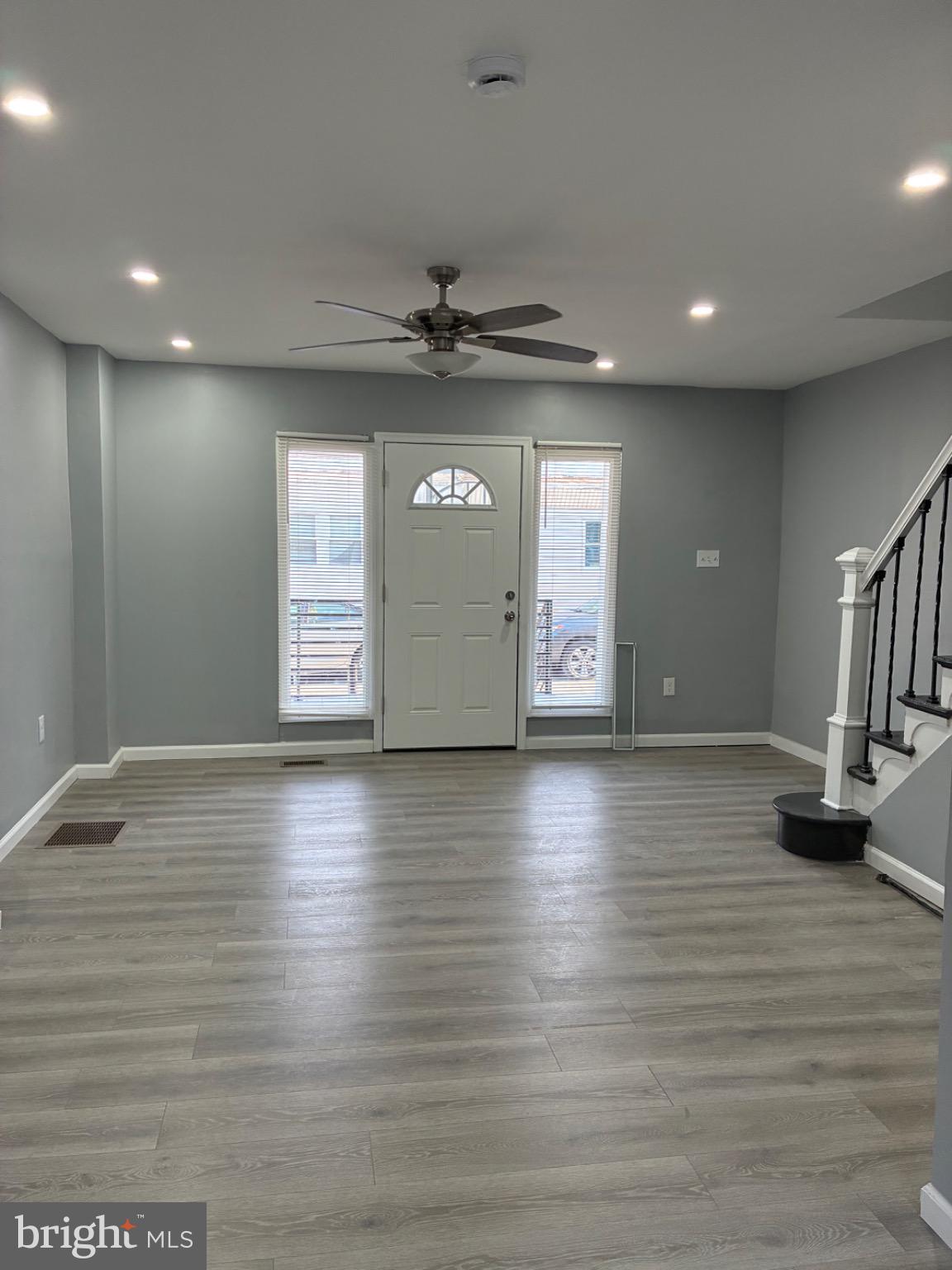 6733 Linmore Avenue Philadelphia, PA 19142 - Photo 29 of 55 a view of an empty room with wooden floor and a window