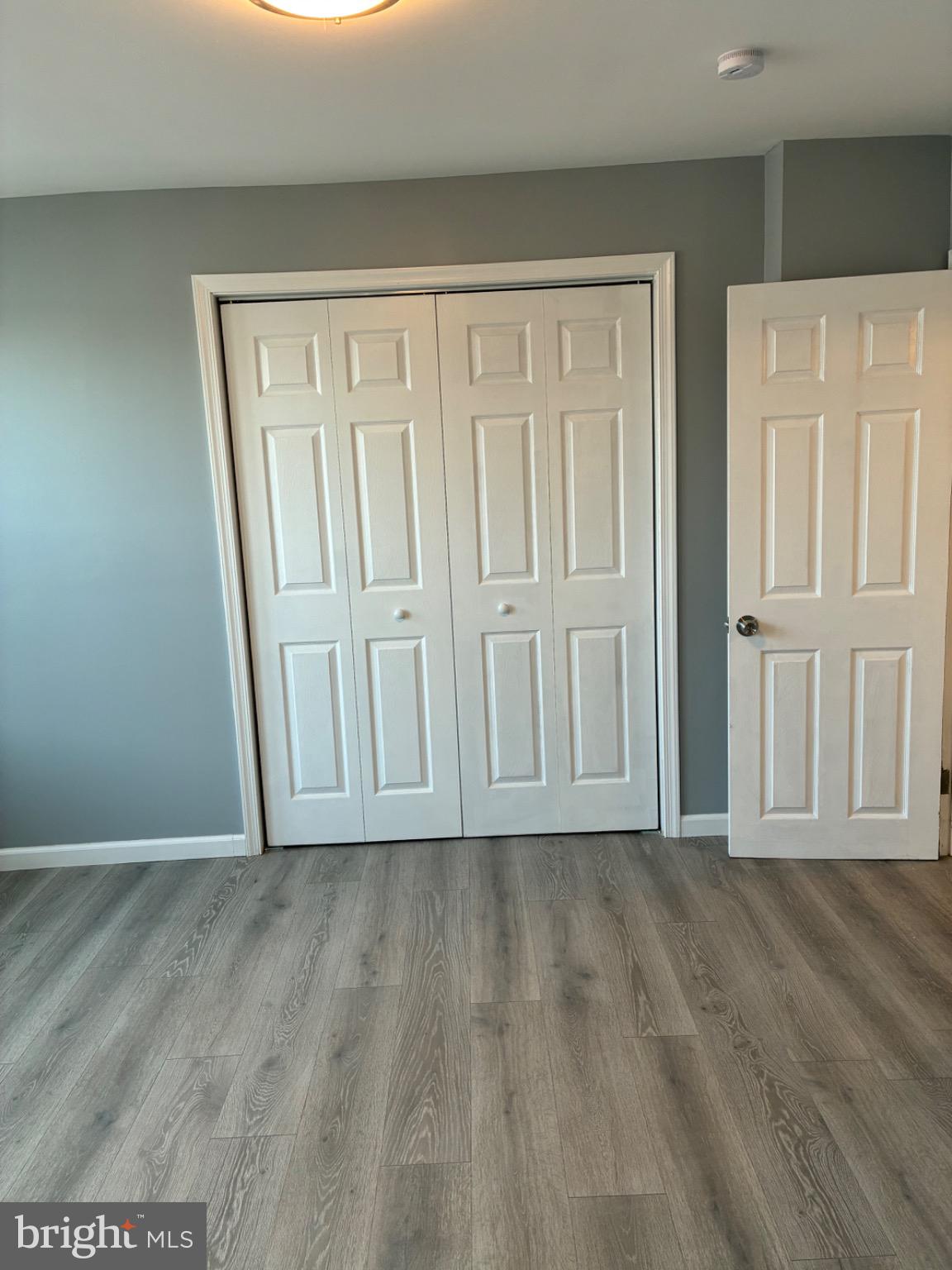 6733 Linmore Avenue Philadelphia, PA 19142 - Photo 44 of 55 a view of empty room with wooden floor