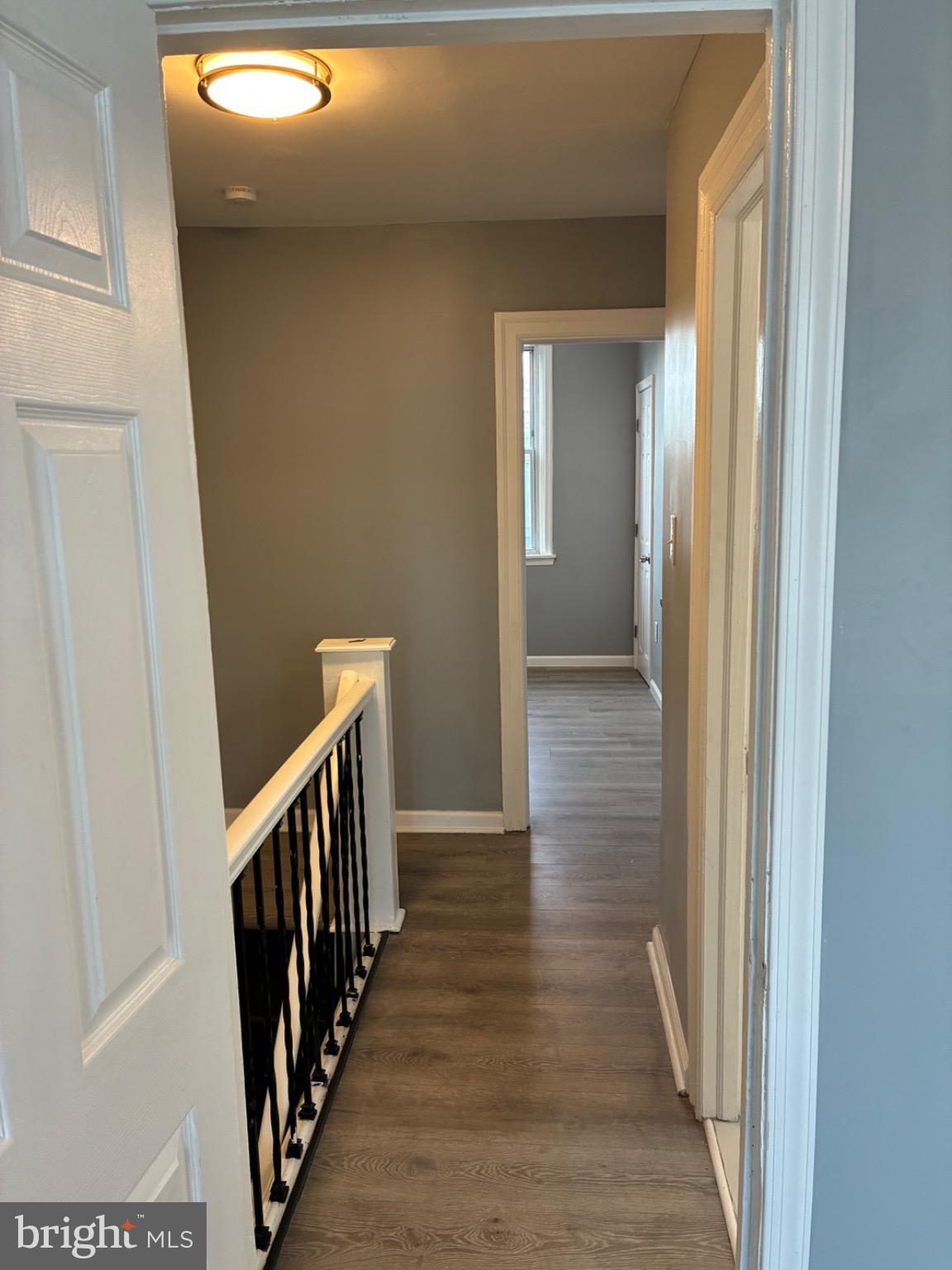 6733 Linmore Avenue Philadelphia, PA 19142 - Photo 46 of 55 a view of a hallway with wooden floor