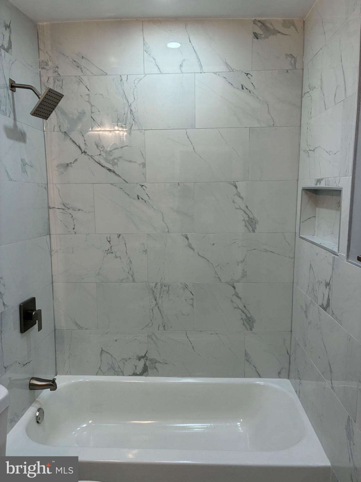 6733 Linmore Avenue Philadelphia, PA 19142 - Photo 50 of 55 a bathroom with a bathtub