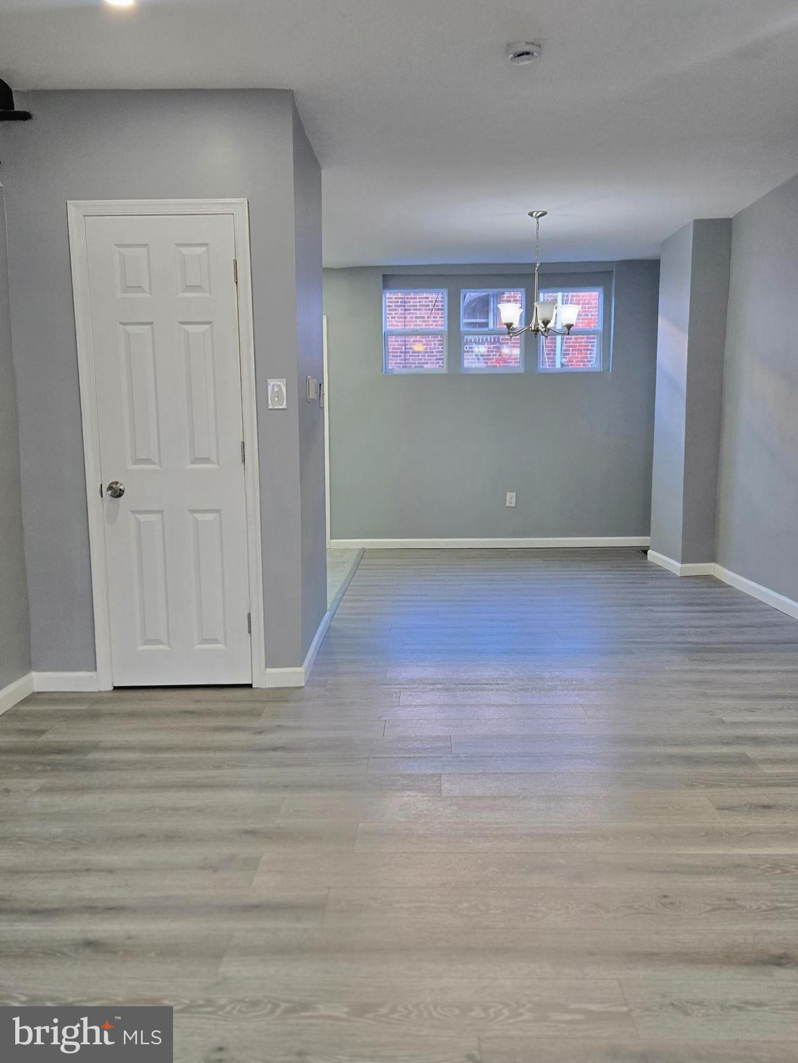 6733 Linmore Avenue Philadelphia, PA 19142 - Photo 5 of 55 a view of wooden floor and window in a room