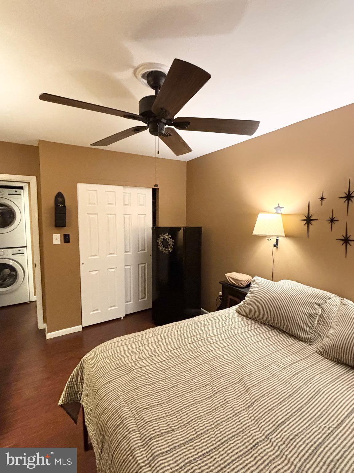 4701 Pennell Road, Unit F7 Aston, PA 19014 - Photo 4 of 13 a bedroom with a bed and a lamp