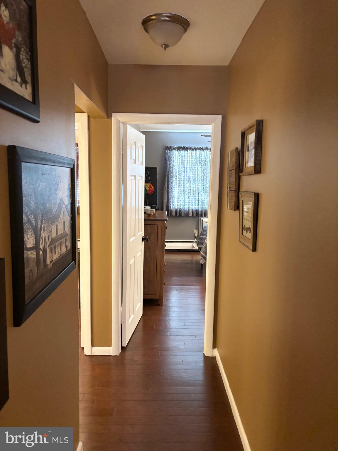 4701 Pennell Road, Unit F7 Aston, PA 19014 - Photo 8 of 13 a view of a hallway view with wooden floor and windows