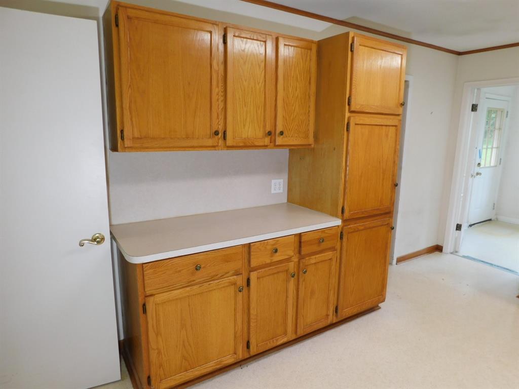 24044 Highway 157 Springhill, LA 71075 - Photo 26 of 40 a kitchen with stainless steel appliances a refrigerator and cabinets