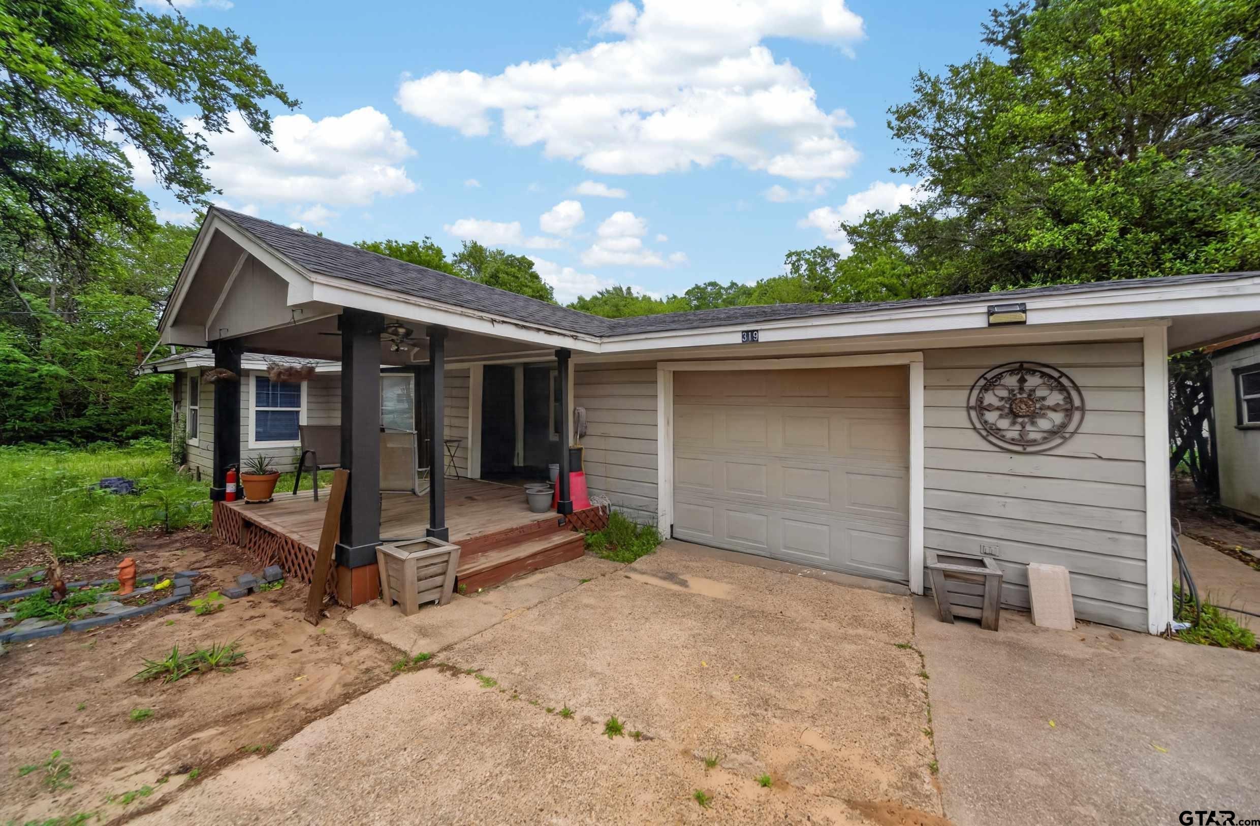 319 McArthur Street Athens, TX 75751 - Photo 2 of 33 a view of a house with a yard and large tree