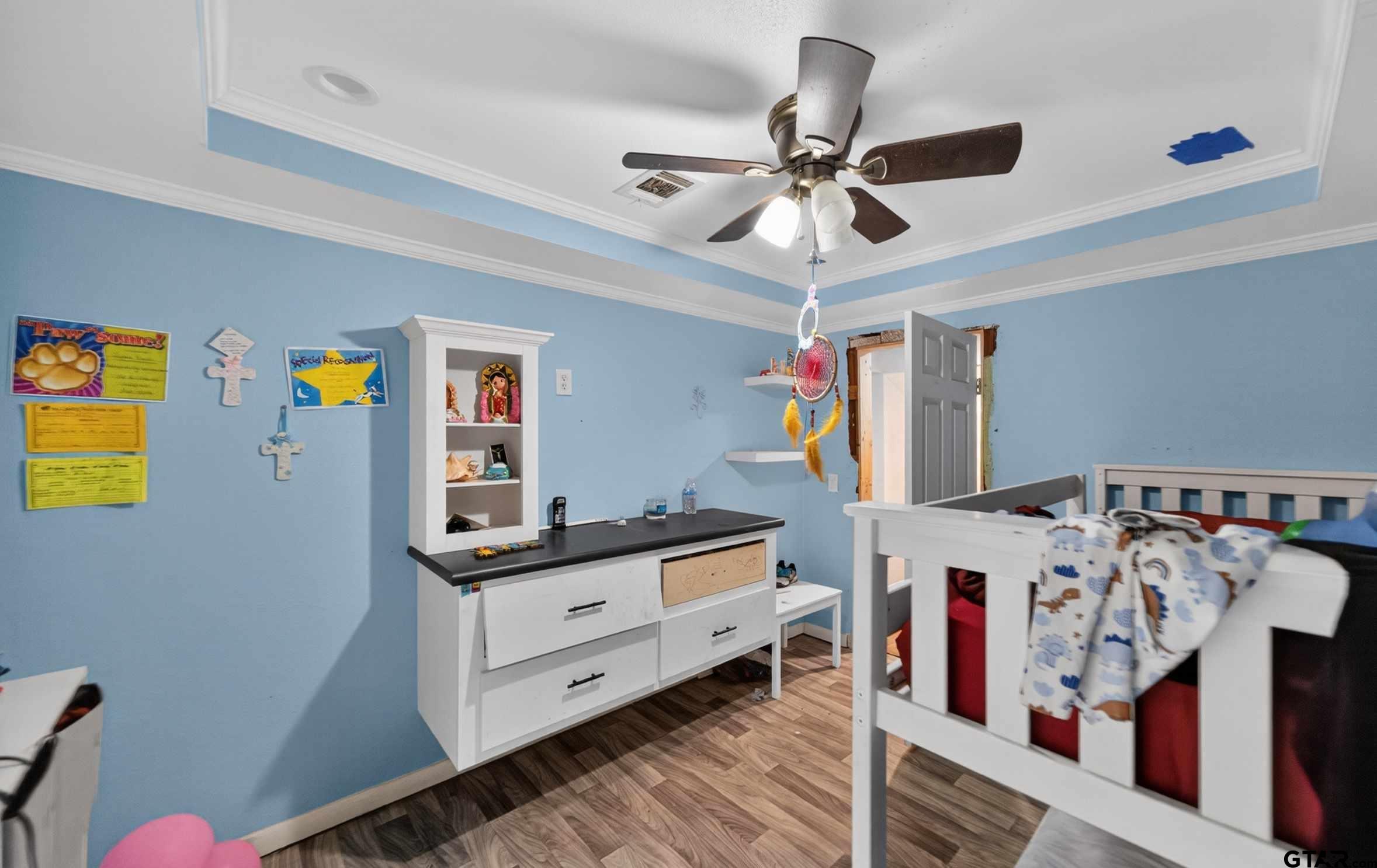 319 McArthur Street Athens, TX 75751 - Photo 22 of 33 a room with furniture and a chandelier