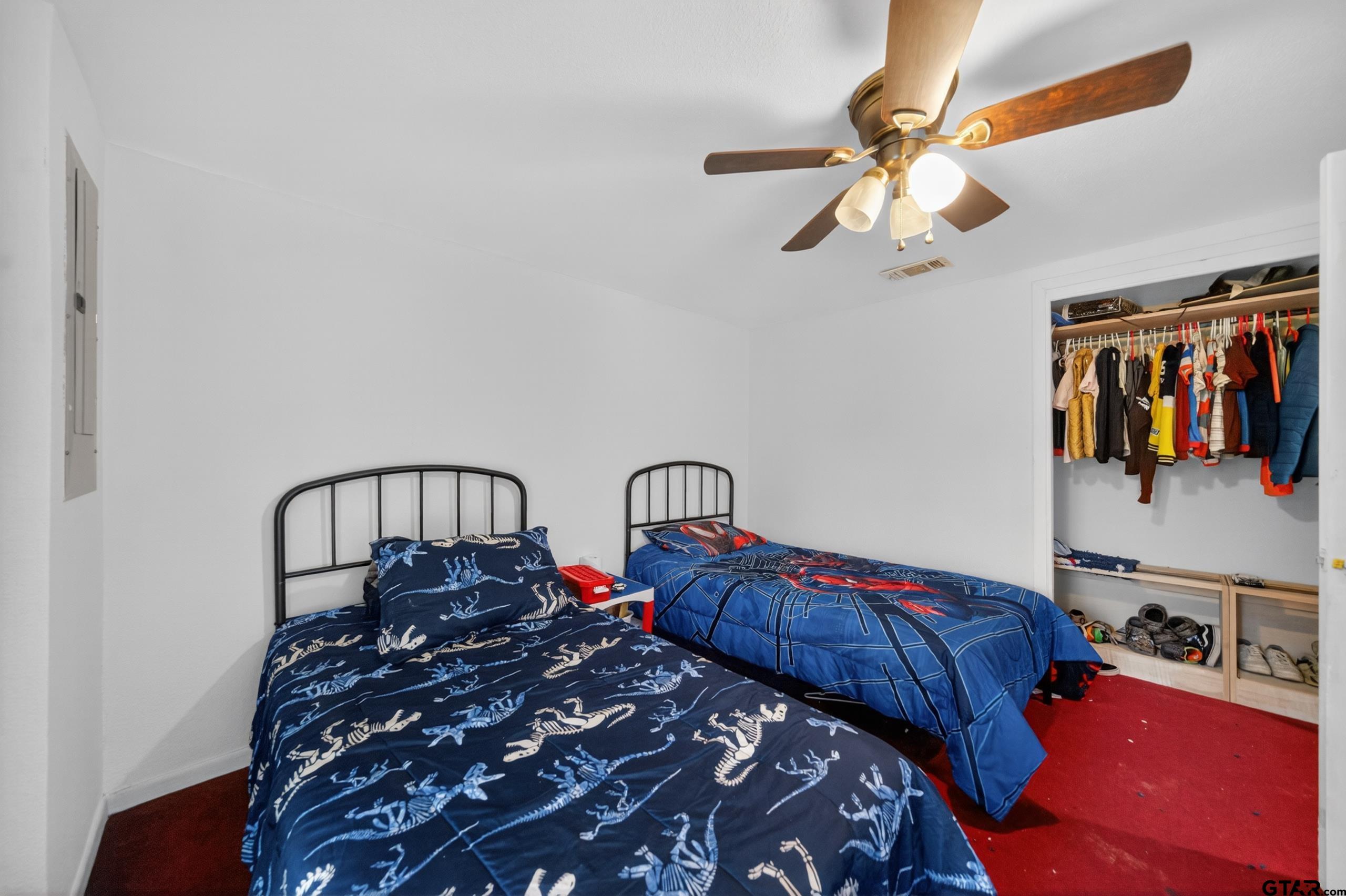 319 McArthur Street Athens, TX 75751 - Photo 24 of 33 a bedroom with two beds and a window