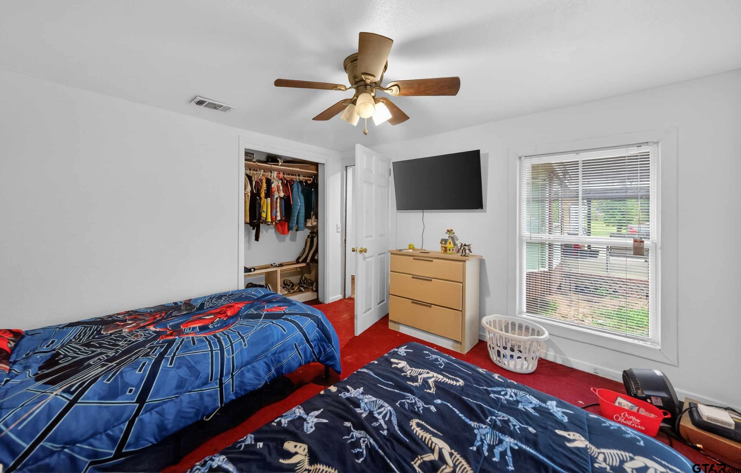 319 McArthur Street Athens, TX 75751 - Photo 25 of 33 a bedroom with bed and a flat tv screen