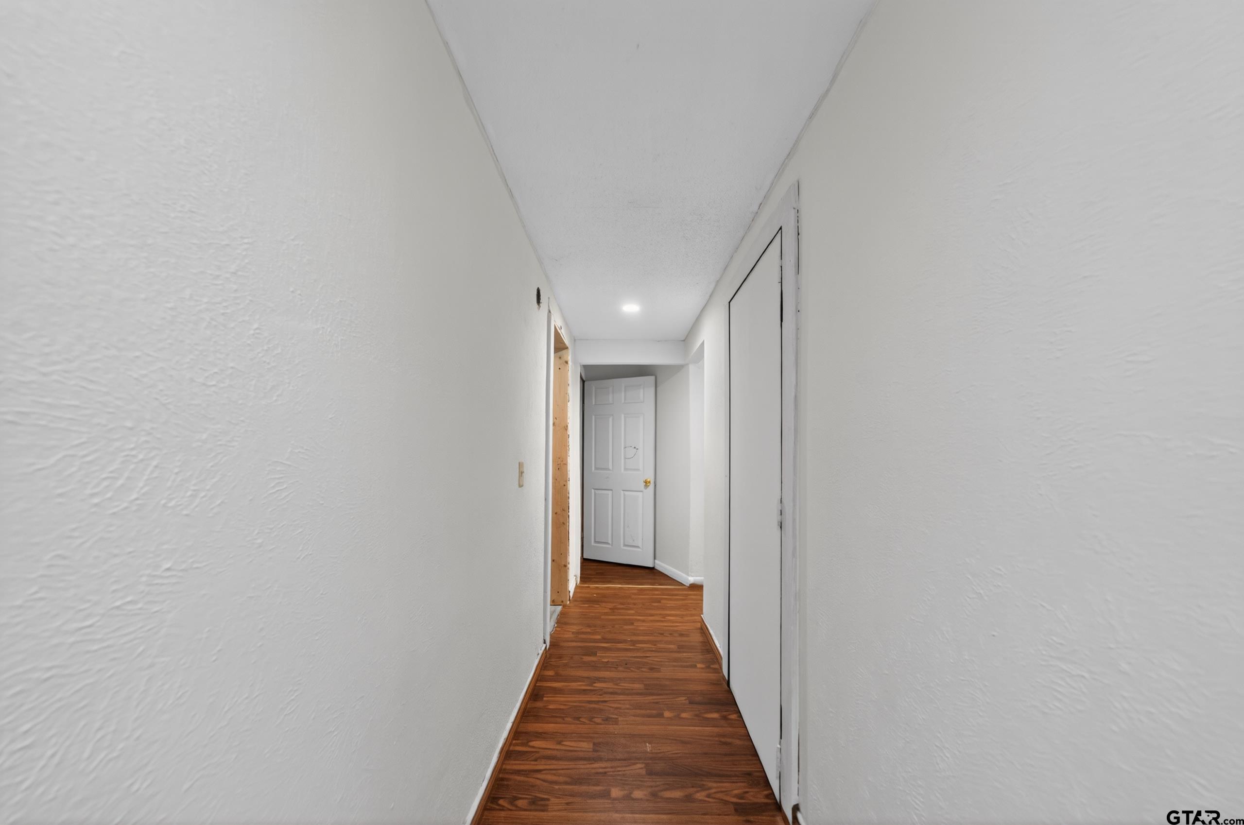 319 McArthur Street Athens, TX 75751 - Photo 26 of 33 a view of a hallway with a white door