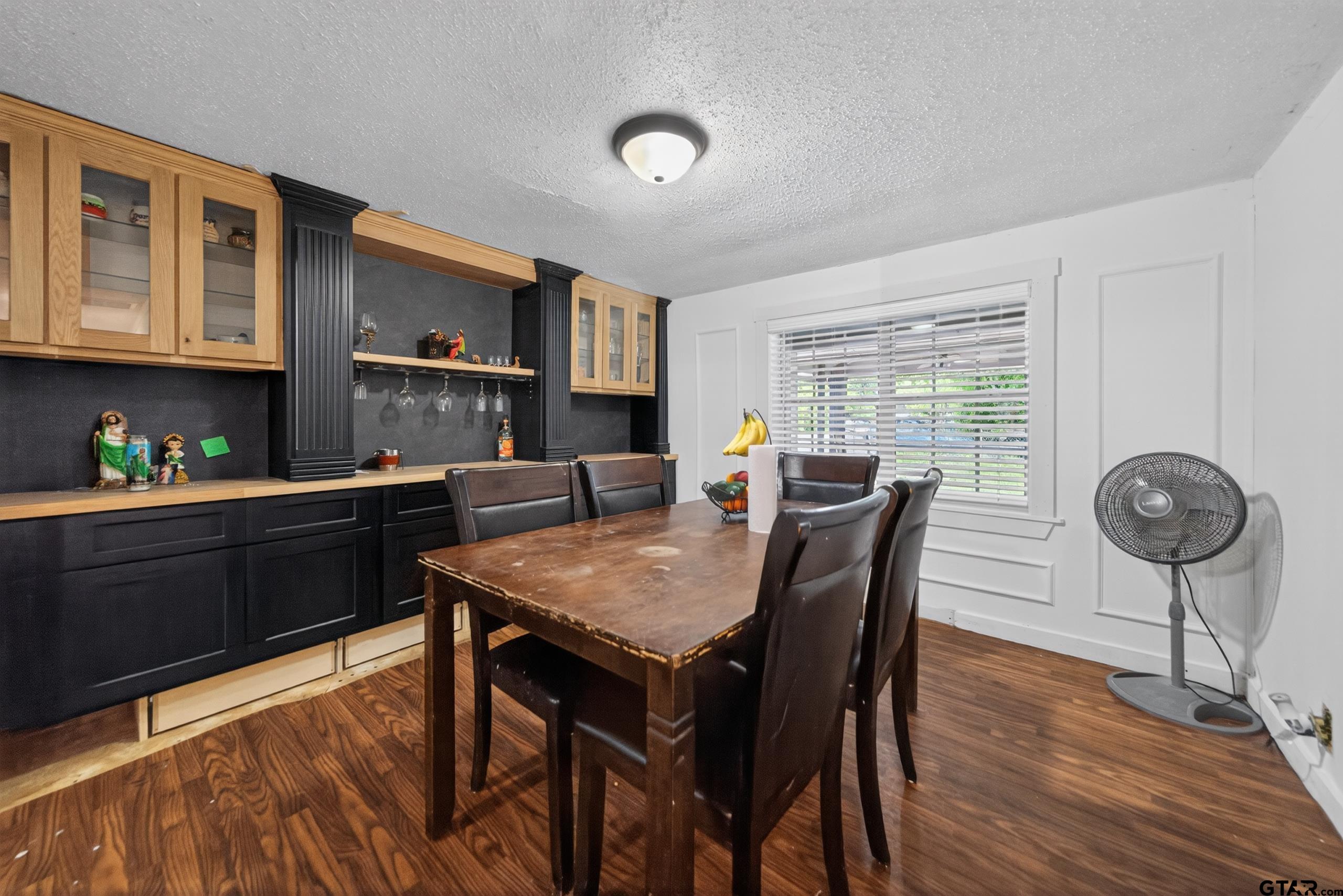319 McArthur Street Athens, TX 75751 - Photo 27 of 33 a kitchen with stainless steel appliances granite countertop a stove top oven a sink dishwasher and cabinets with wooden floor