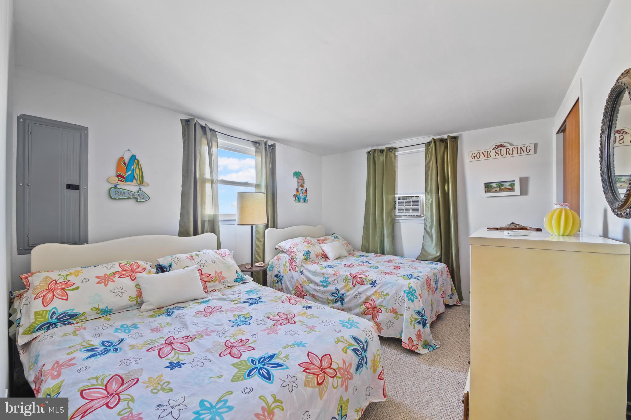 33 Adrian Road Long Beach Township, NJ 08006 - Photo 14 of 31 a bedroom with two beds and a window