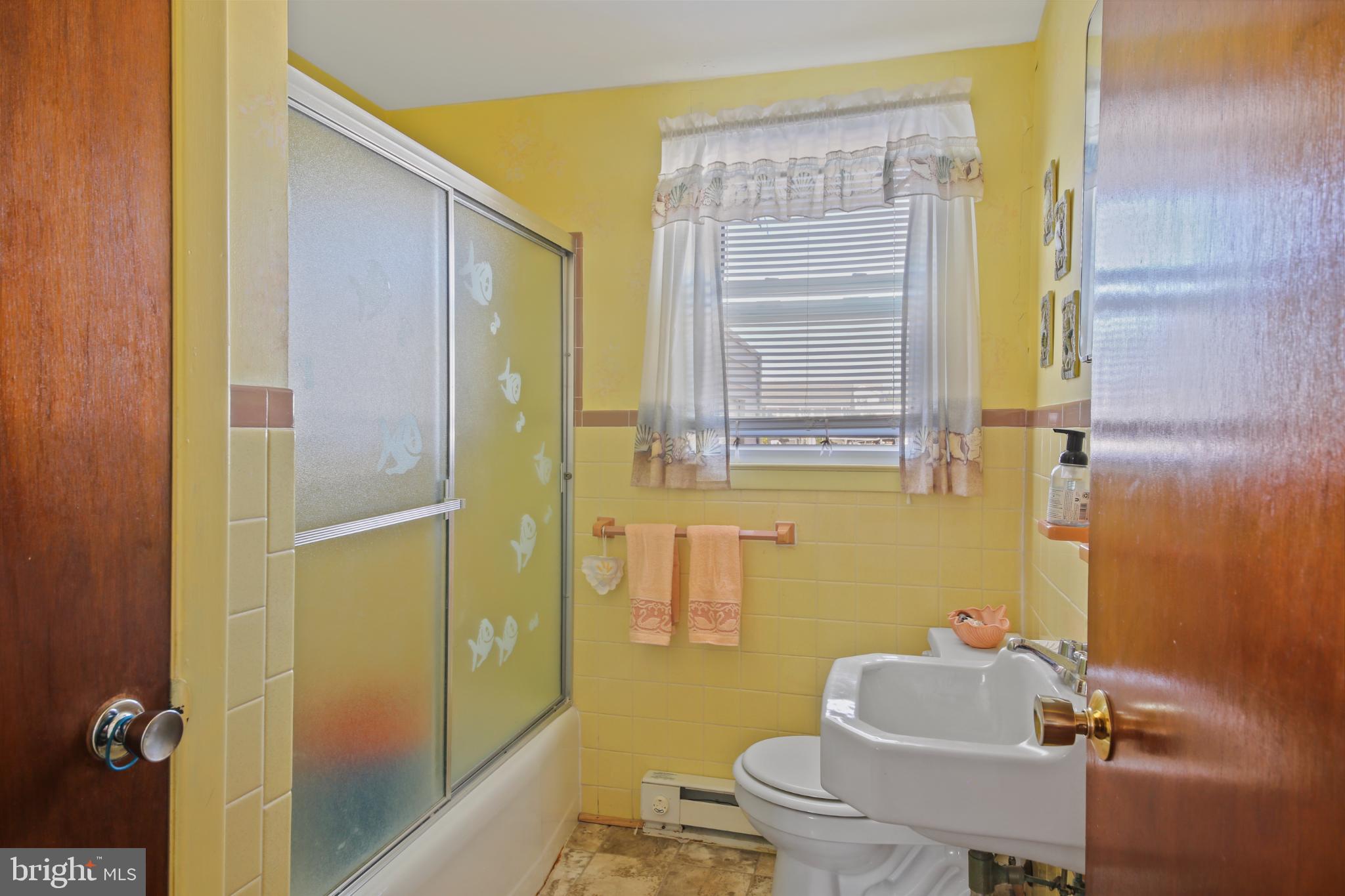 33 Adrian Road Long Beach Township, NJ 08006 - Photo 15 of 31 a bathroom with a sink and toilet