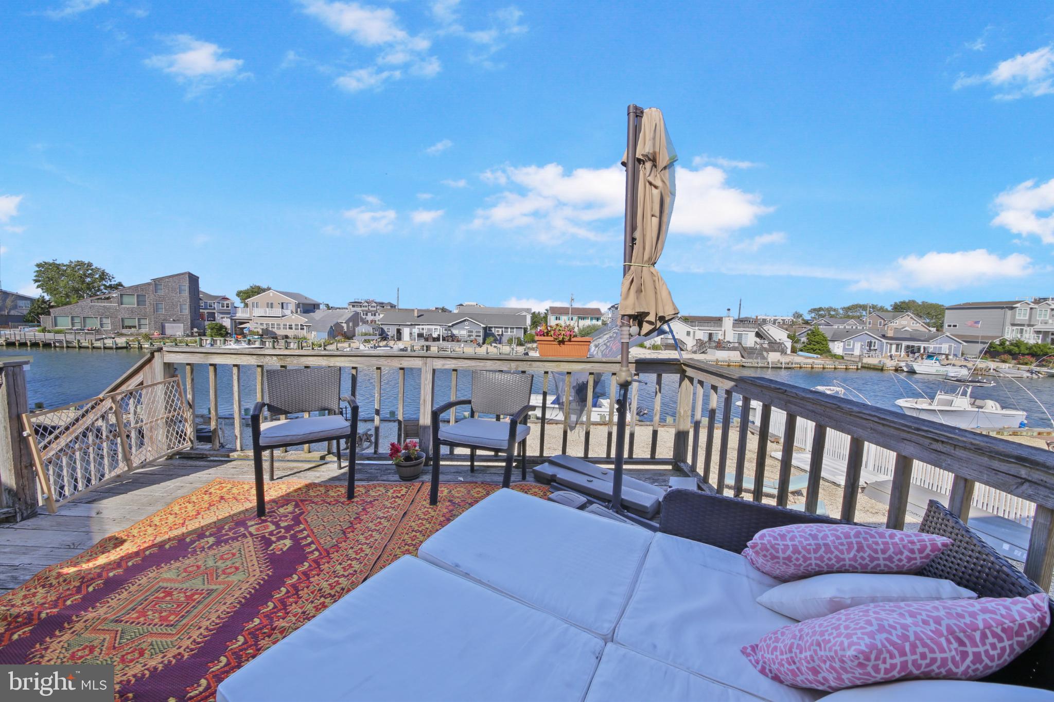 33 Adrian Road Long Beach Township, NJ 08006 - Photo 19 of 31 a view of a balcony with furniture