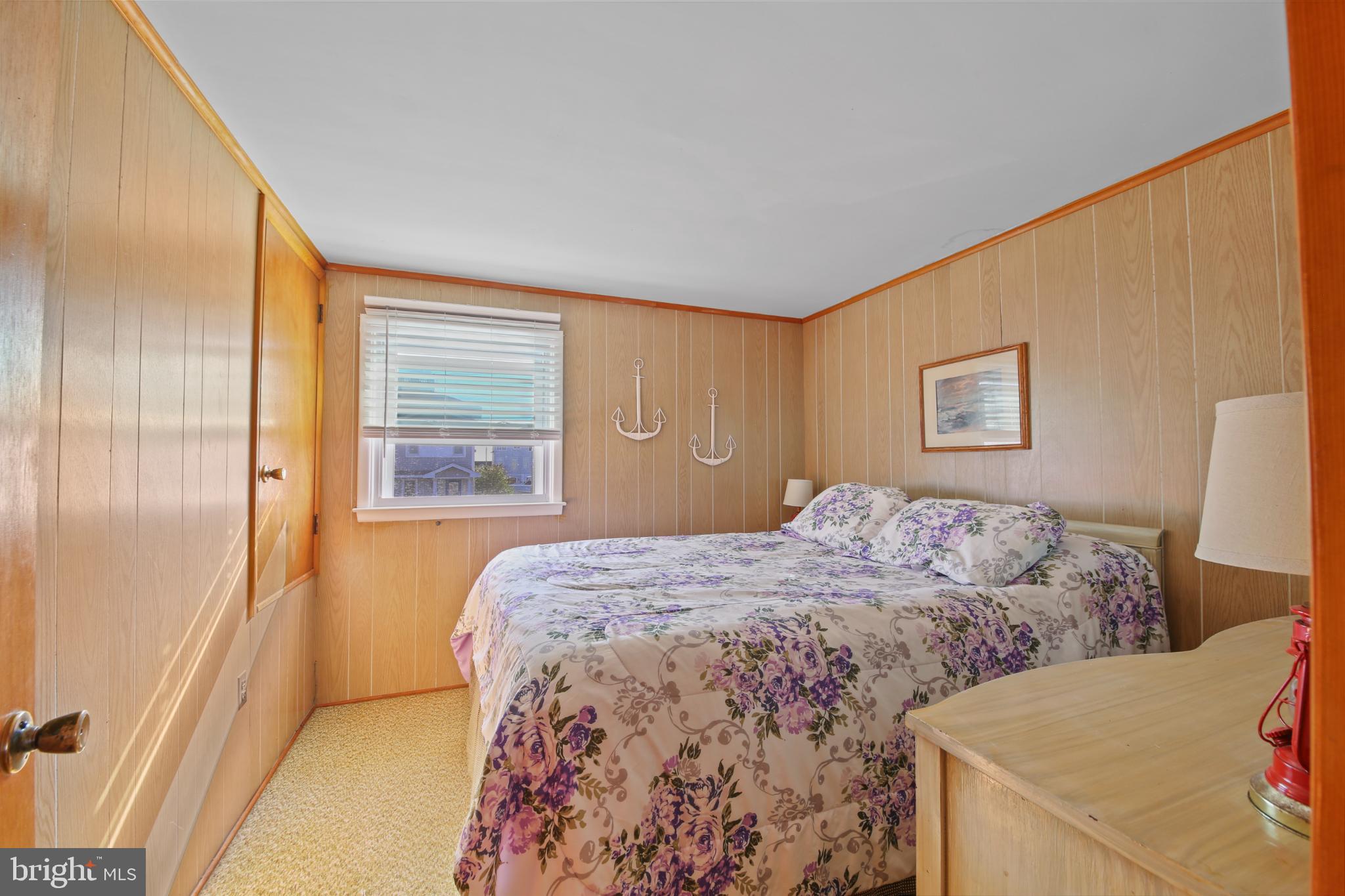 33 Adrian Road Long Beach Township, NJ 08006 - Photo 22 of 31 a bedroom with a bed and a window
