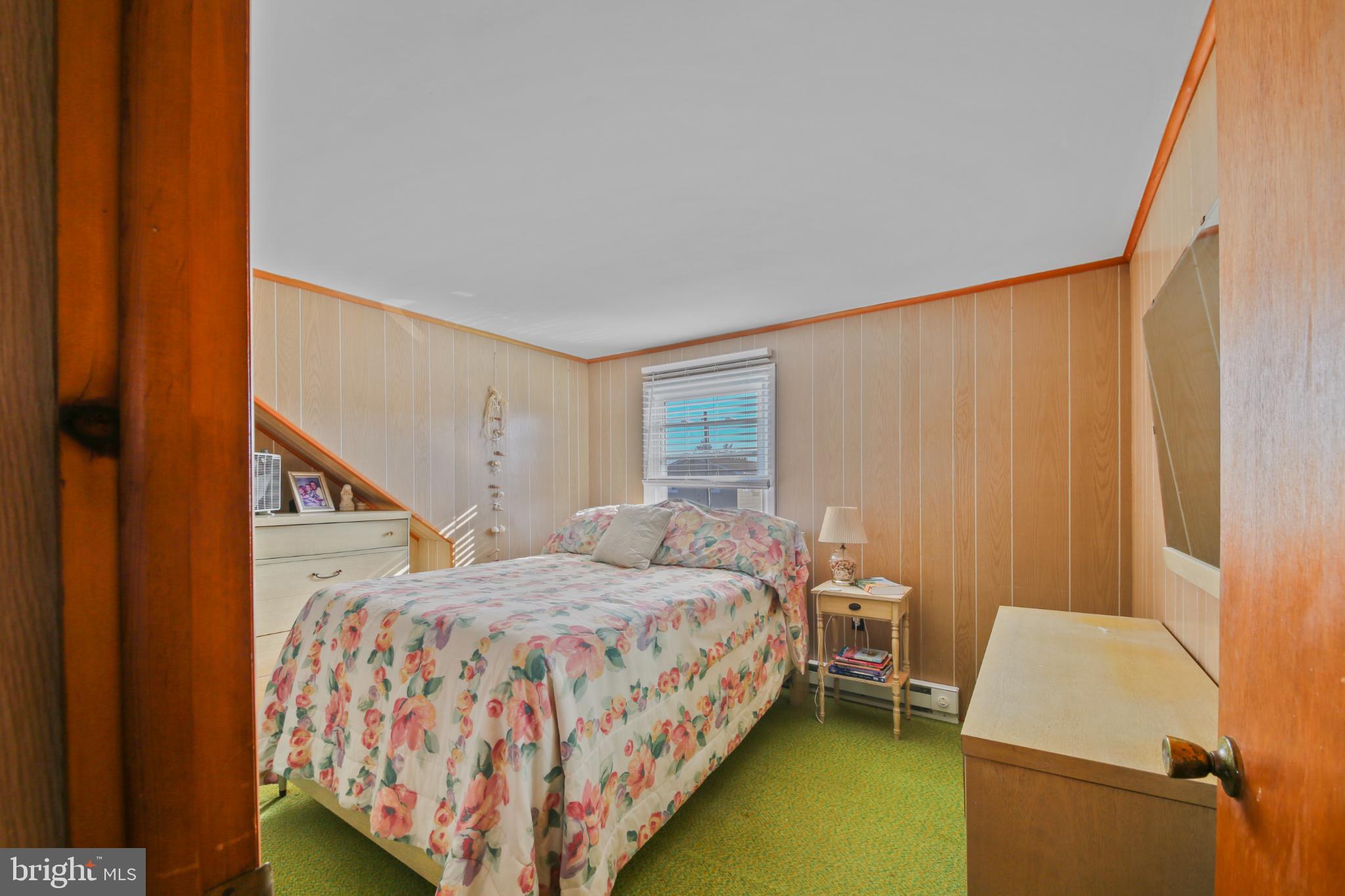 33 Adrian Road Long Beach Township, NJ 08006 - Photo 25 of 31 a bed room with a bed and a chair