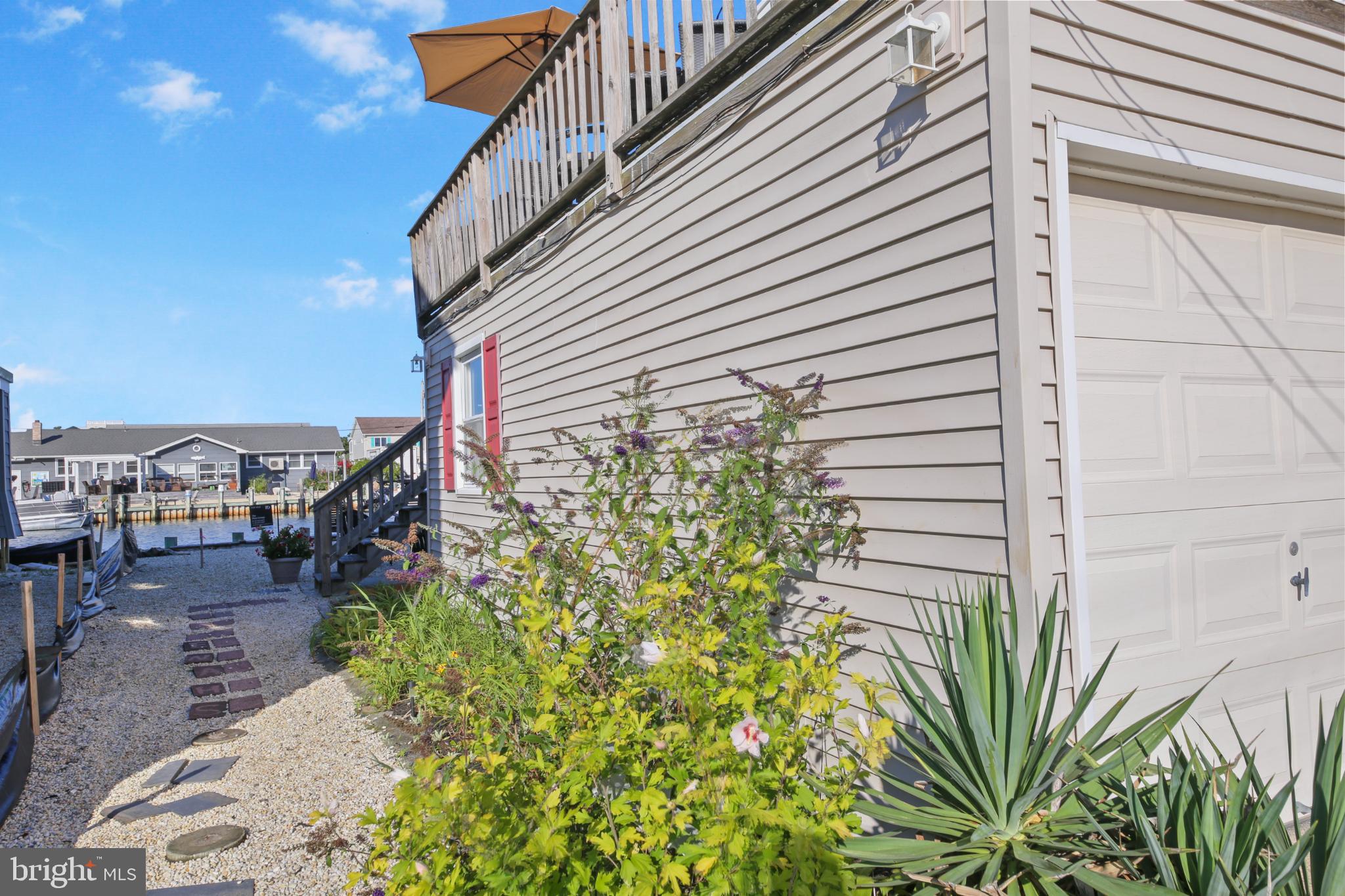 33 Adrian Road Long Beach Township, NJ 08006 - Photo 29 of 31 a view of a small yard front of house