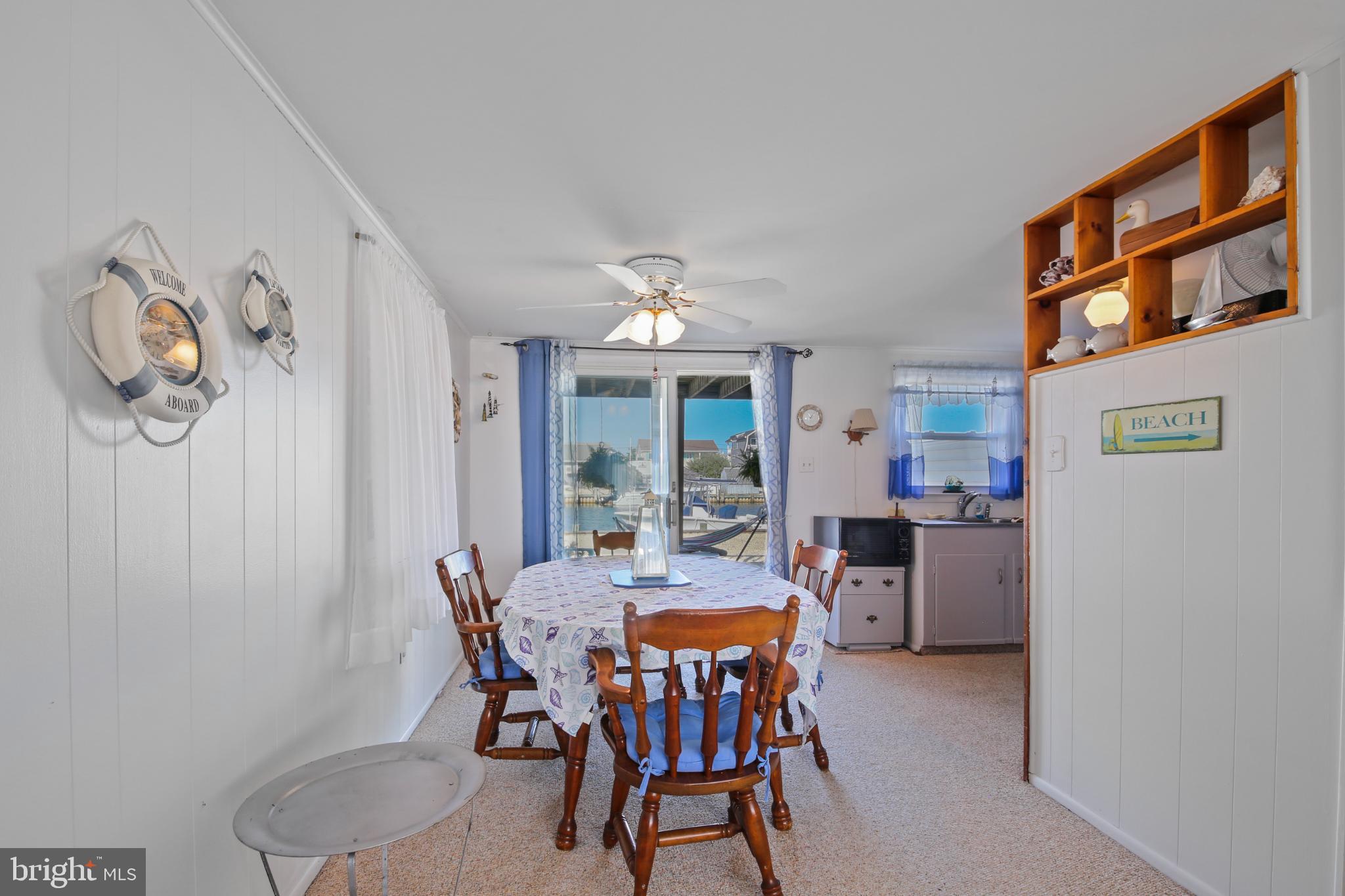 33 Adrian Road Long Beach Township, NJ 08006 - Photo 10 of 31 a view of a dining room with furniture window and outside view