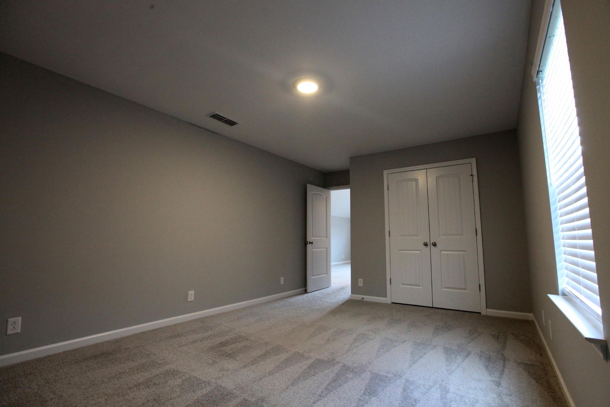 3718 Black Powder Lane Rockvale, TN 37153 - Photo 24 of 31 an empty room with wooden floor and windows