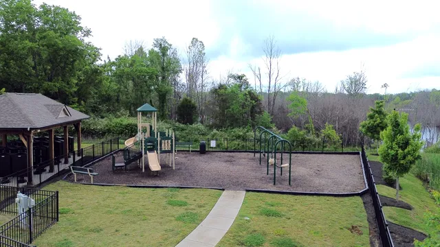 a view of a backyard with sitting area