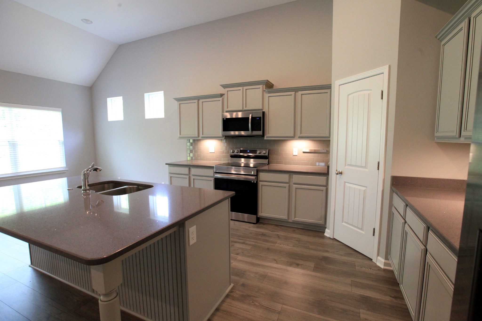 3718 Black Powder Lane Rockvale, TN 37153 - Photo 6 of 31 a kitchen with kitchen island a counter space a sink appliances and cabinets