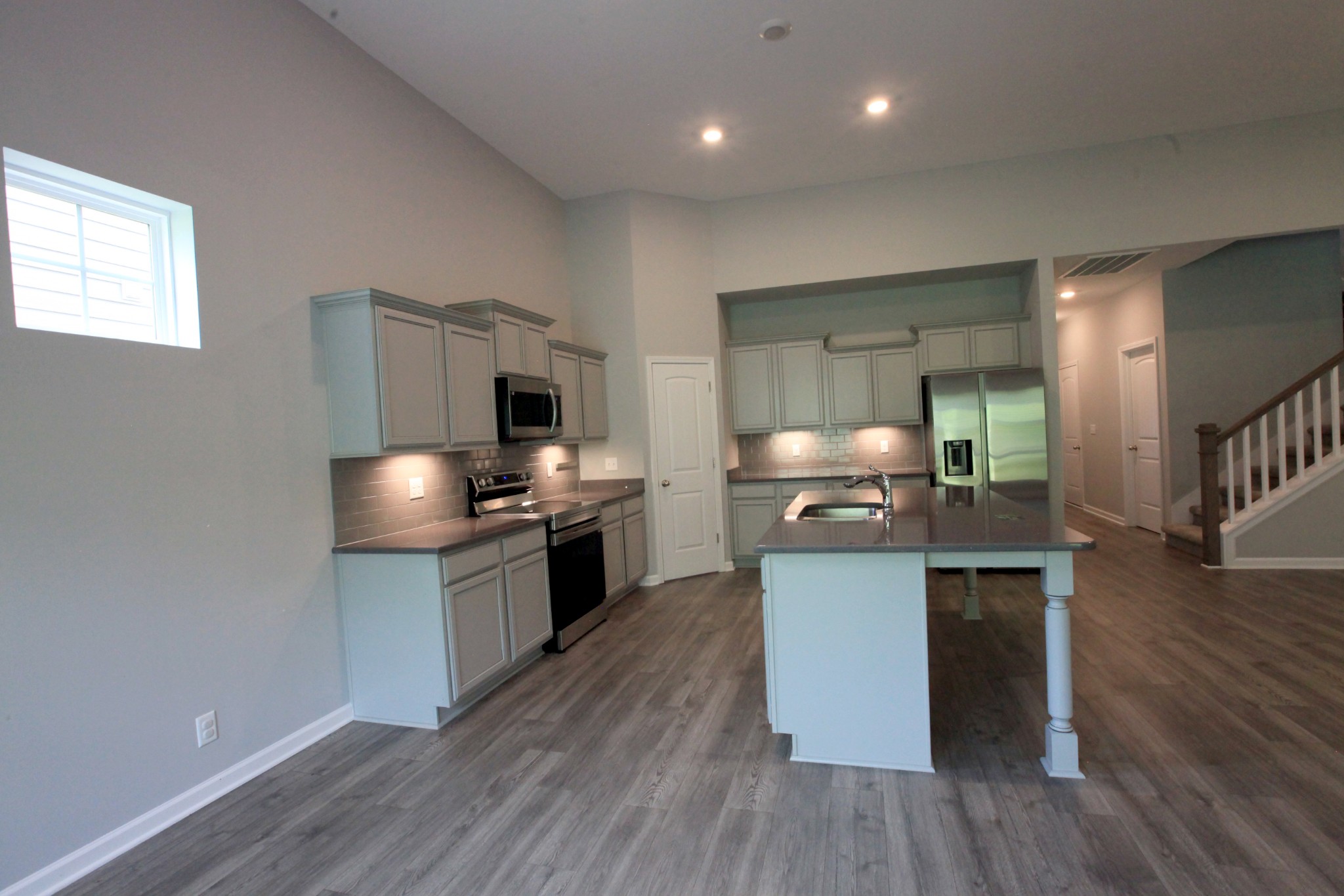3718 Black Powder Lane Rockvale, TN 37153 - Photo 7 of 31 a kitchen with stainless steel appliances wooden floor and view living room