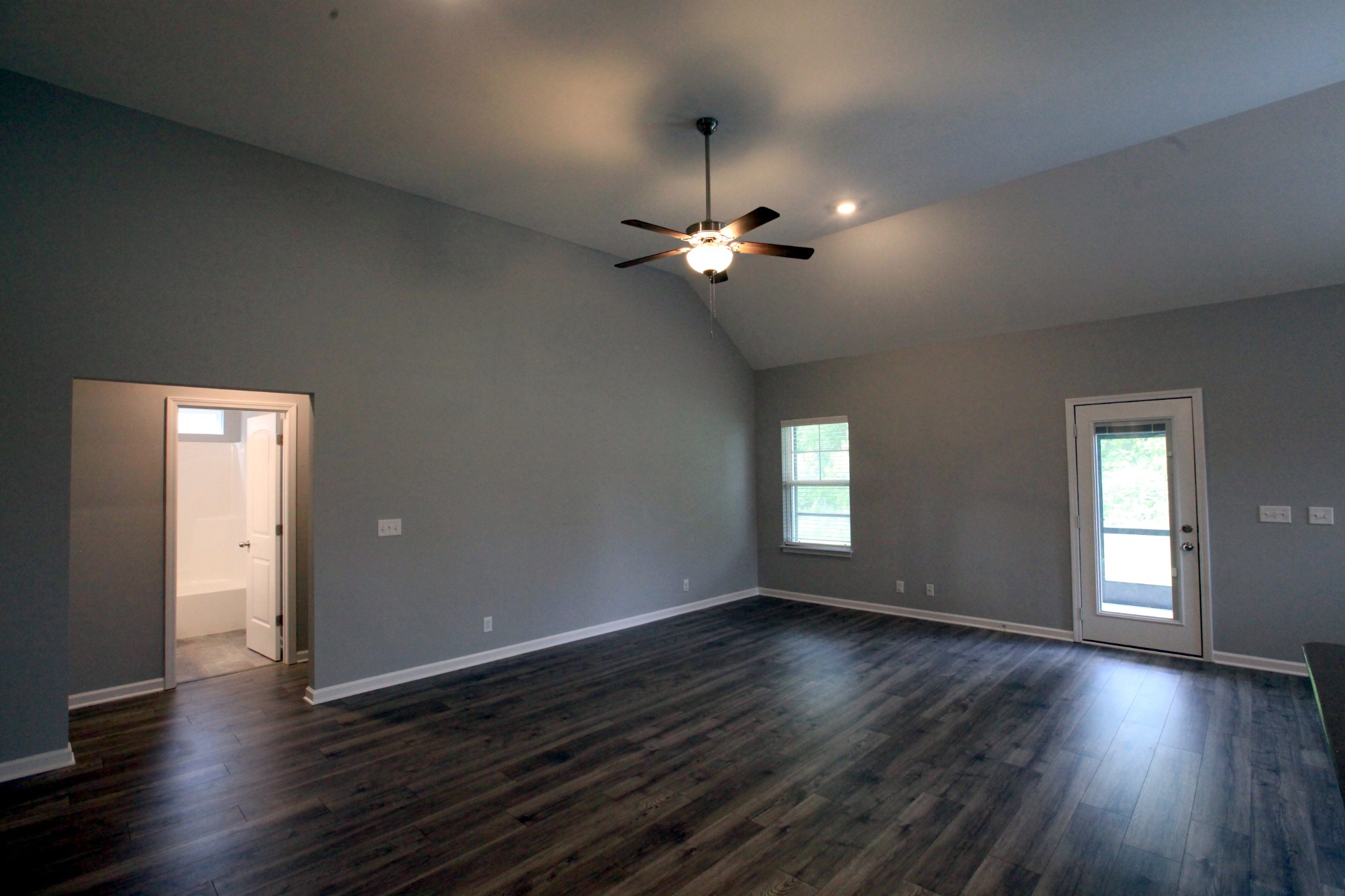 3718 Black Powder Lane Rockvale, TN 37153 - Photo 9 of 31 a view of an empty room with wooden floor and a window