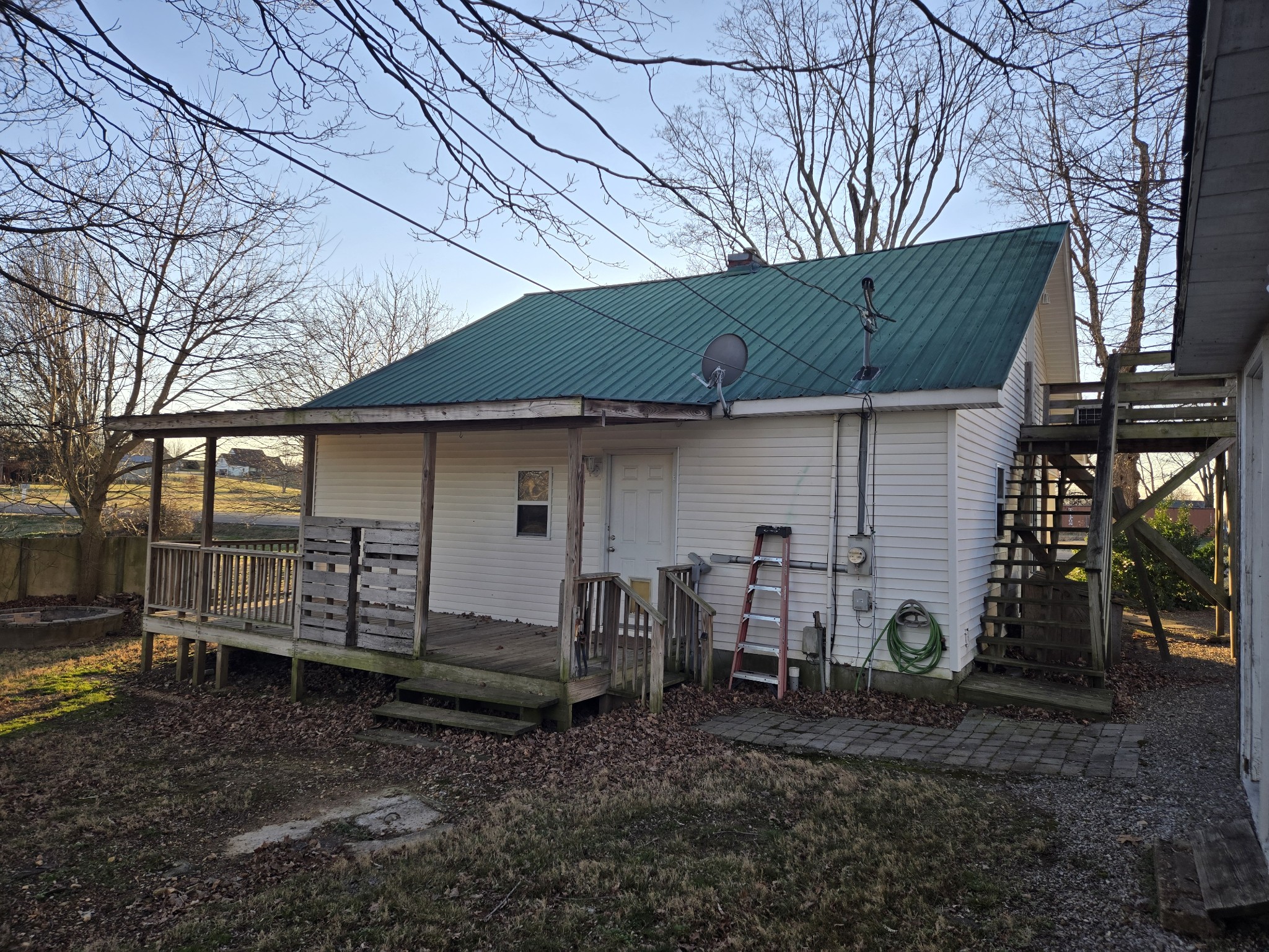 3769 Calista Road Cross Plains, TN 37049 - Photo 8 of 8 a view of a house with a backyard and chairs