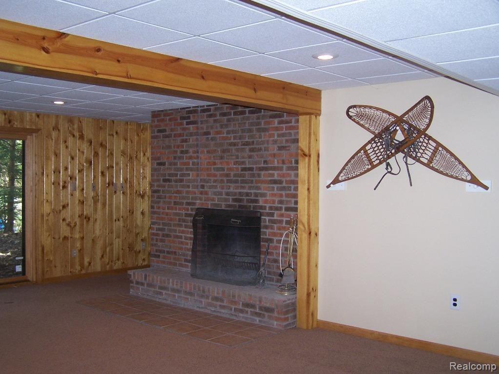 2896 North Tipsico Lake Road Hartland, MI 48353 - Photo 13 of 24 2896 Tipsico Lake Lower Level Fireplace.jpg