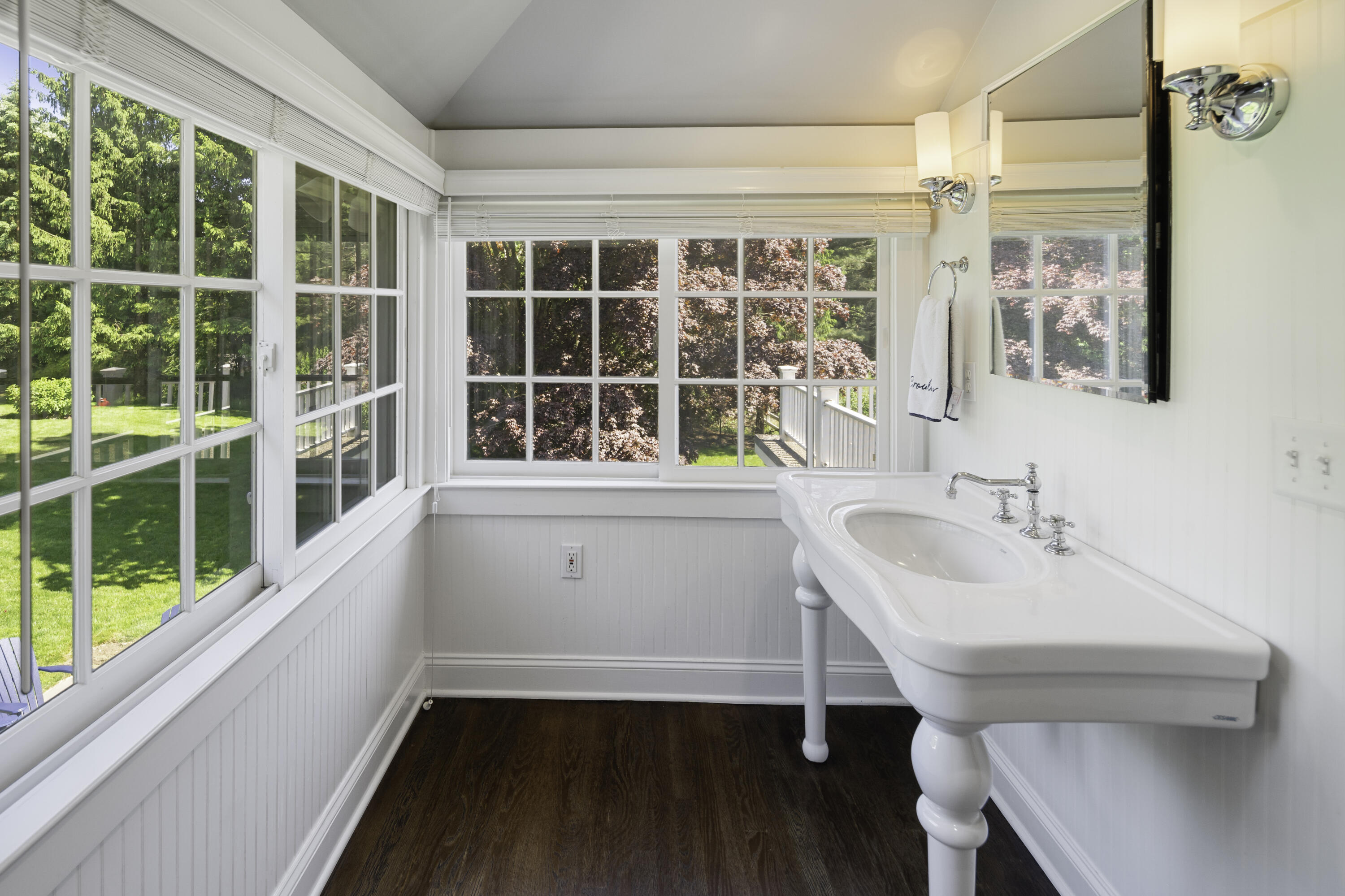 31 Bayberry Road New Canaan, CT 06840 - Photo 33 of 47 a bathroom with a sink and a window