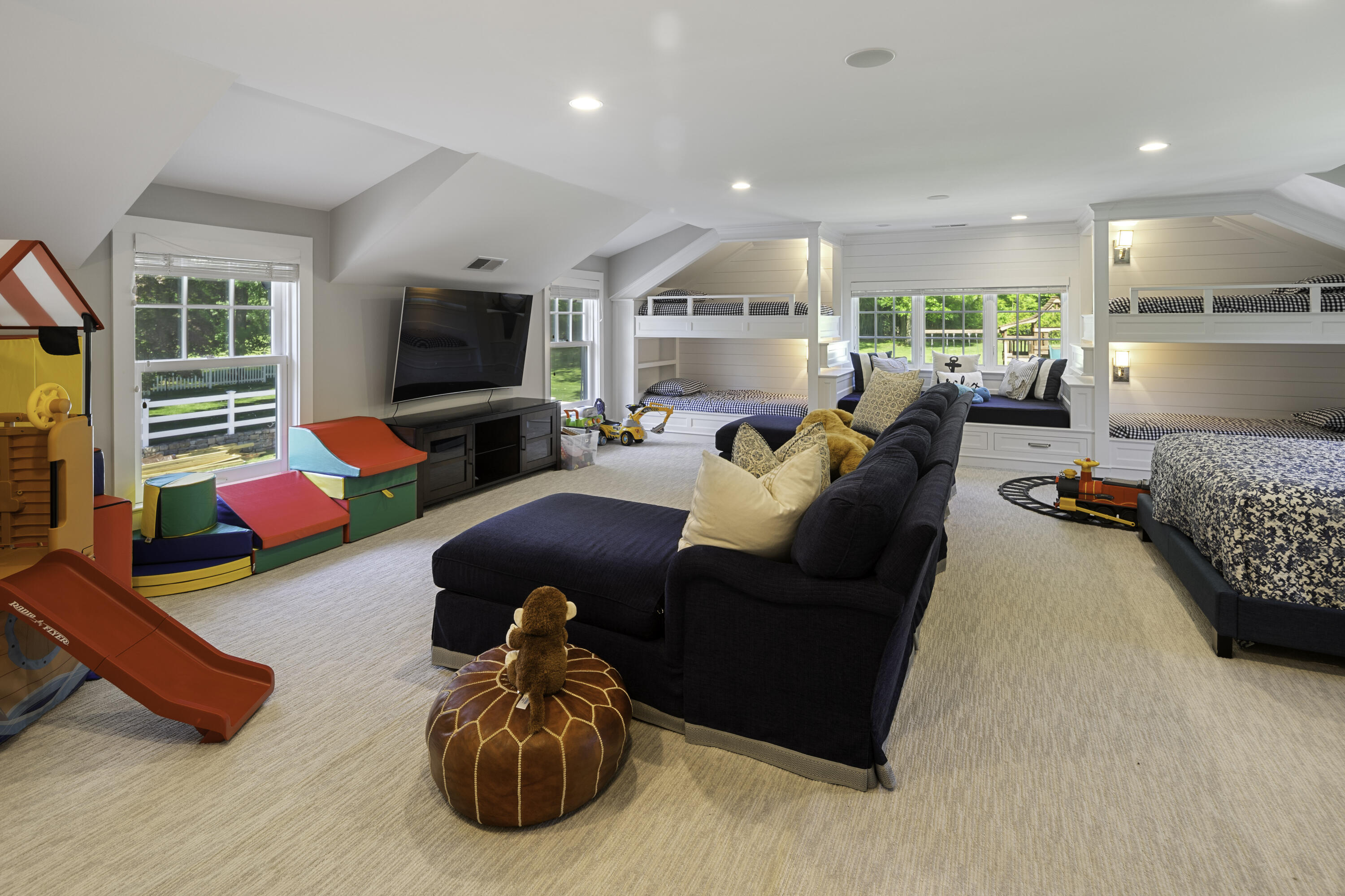 31 Bayberry Road New Canaan, CT 06840 - Photo 36 of 47 a living room with furniture and a flat screen tv