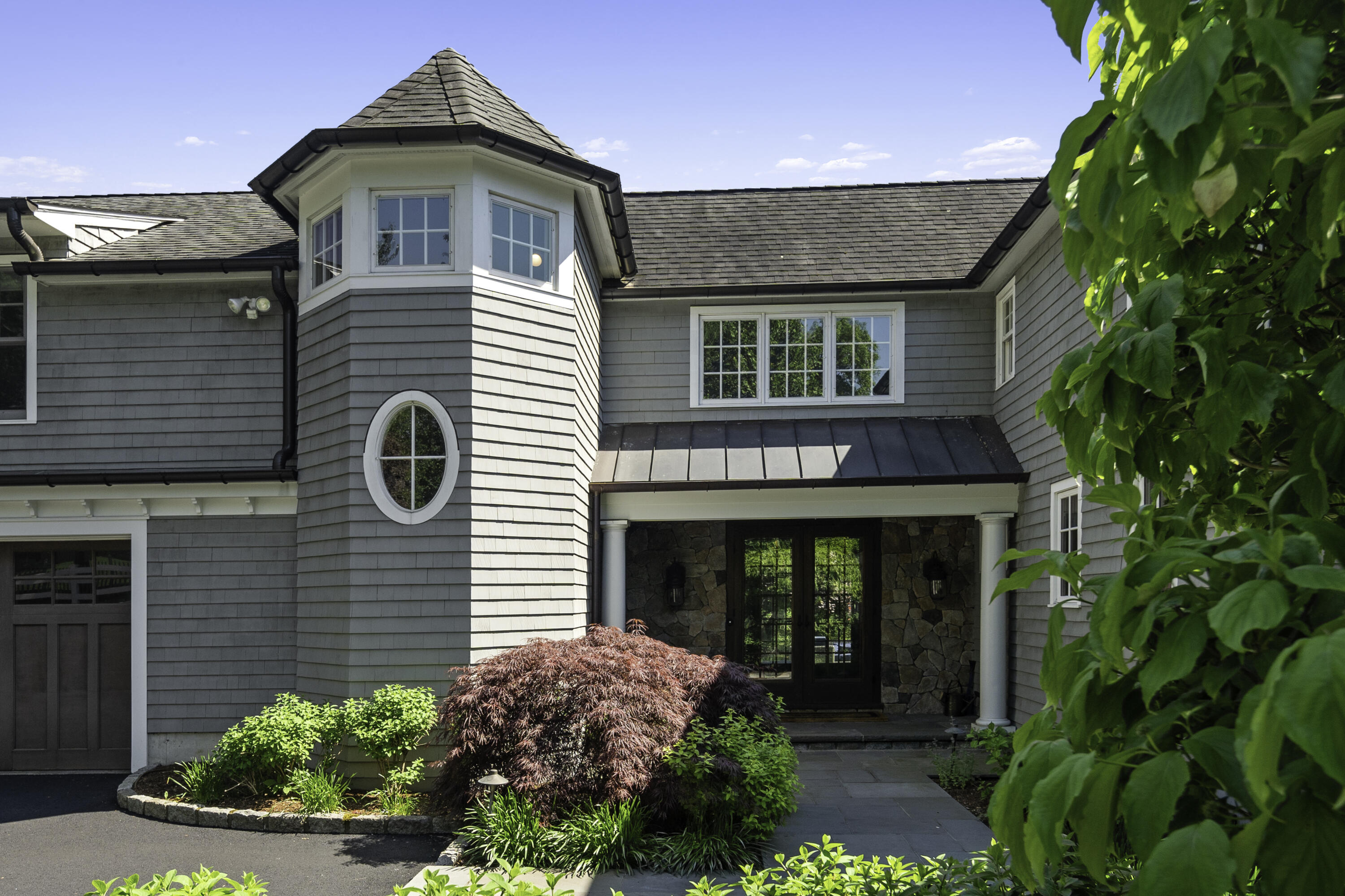 31 Bayberry Road New Canaan, CT 06840 - Photo 4 of 47 a front view of a house with plants