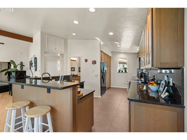 a kitchen with sink and cabinets